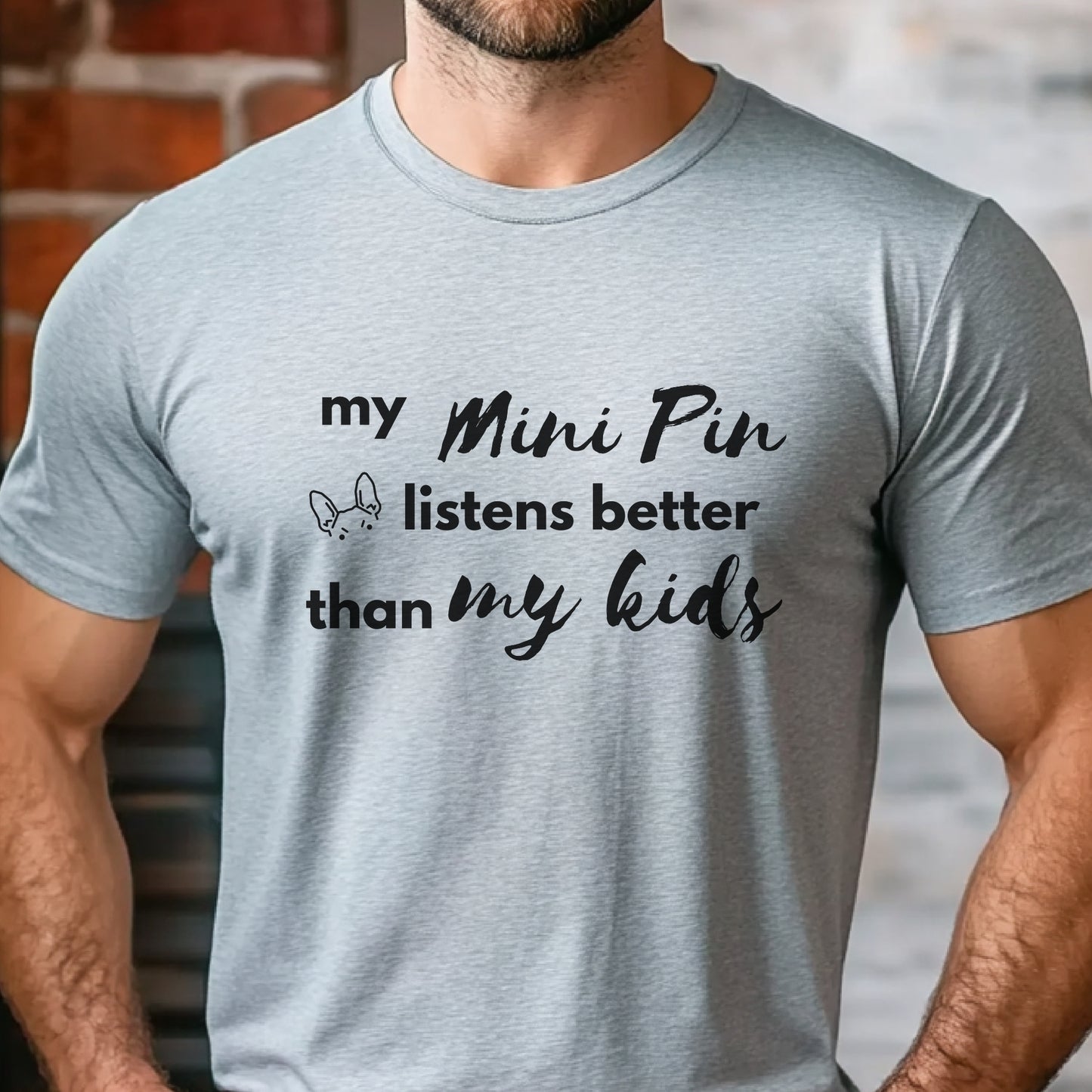 Grey unisex t-shirt with white text: "my Mini Pin listens better than my kids" and a small Miniature Pinscher face illustration