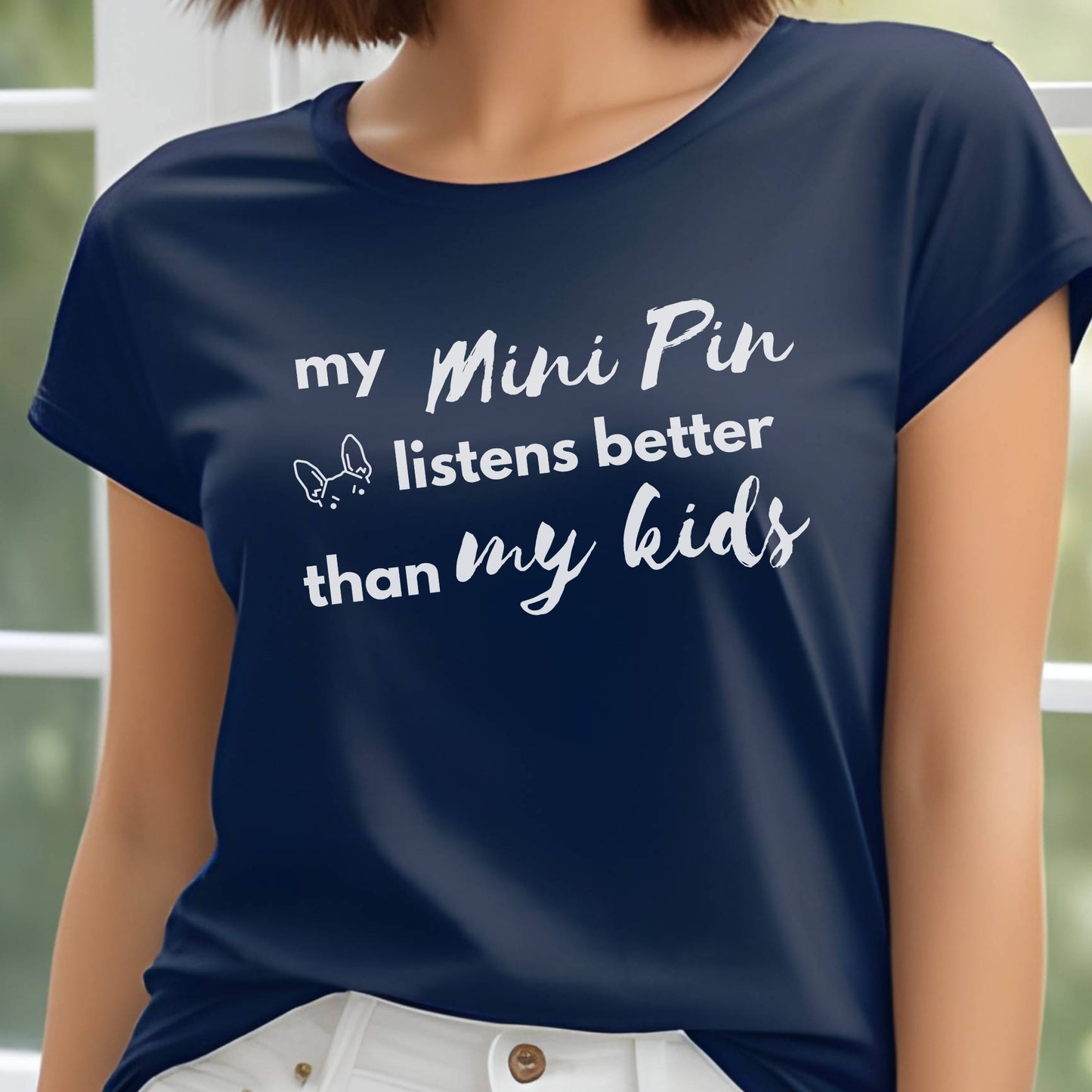Navy unisex t-shirt with white text: "my Mini Pin listens better than my kids" and a small Miniature Pinscher face illustration
