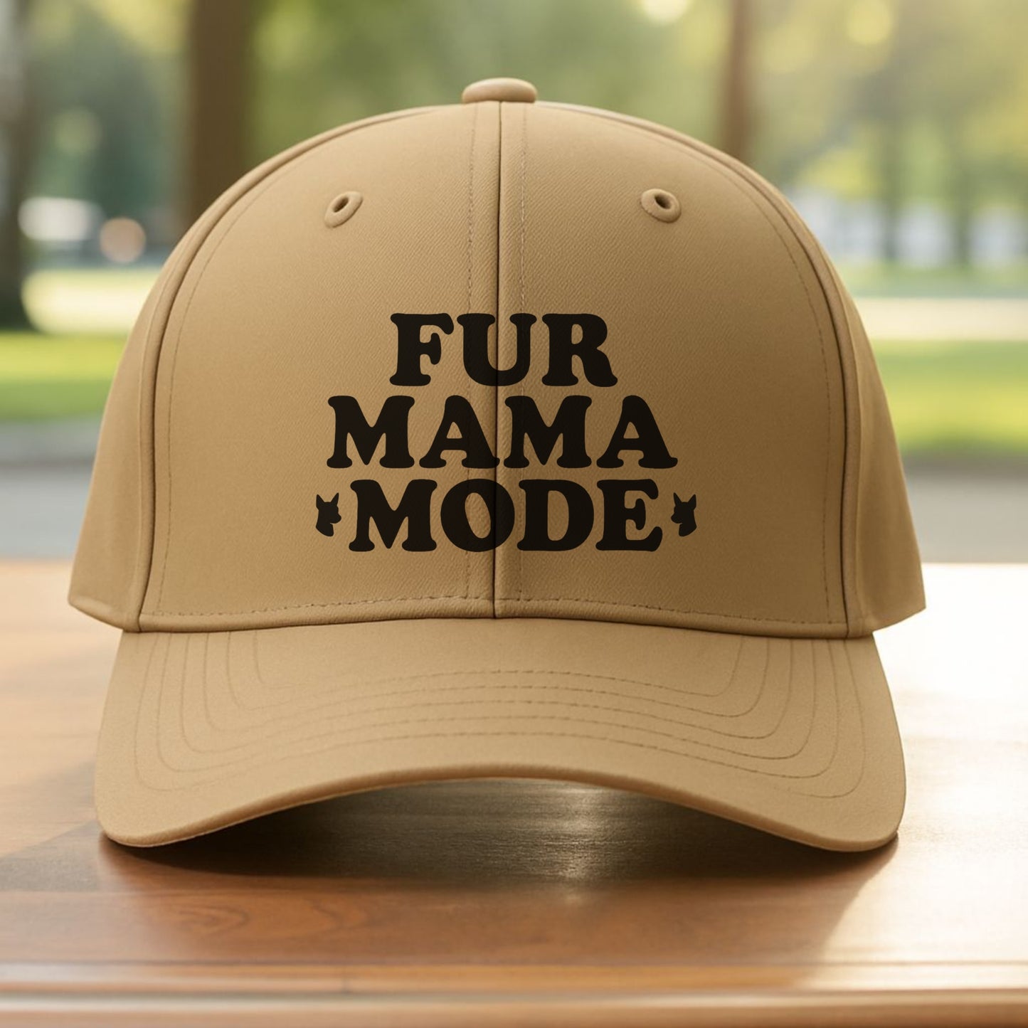 Khaki "Fur Mama Mode" Miniature Pinscher cap on a wooden table at the beach, perfect for dog moms and Min Pin lovers