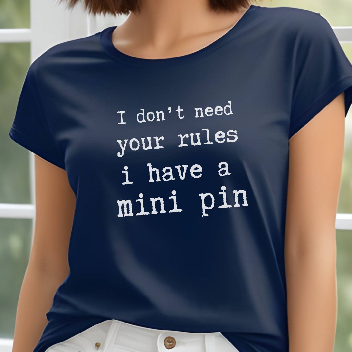 Navy unisex t-shirt with white text: "I don’t need your rules, I have a mini pin" centered on the chest