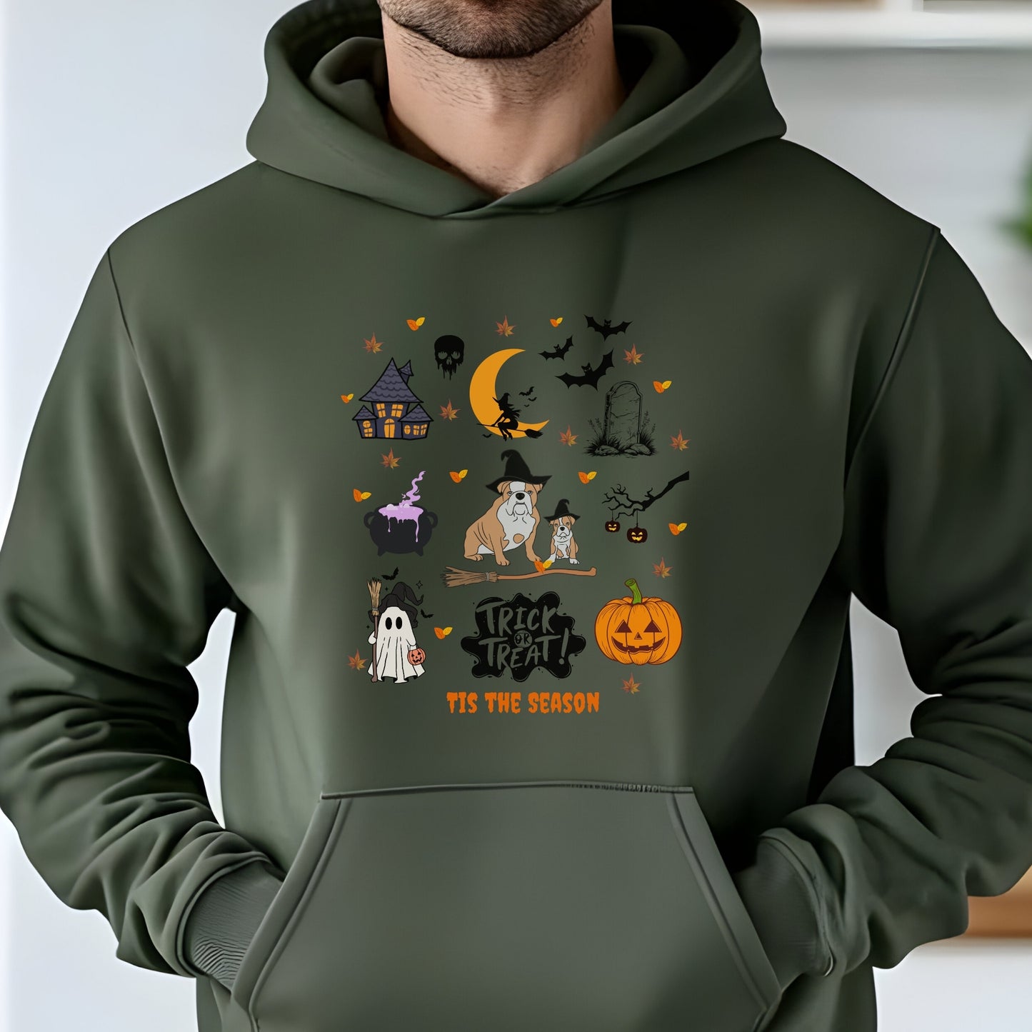 Military Green hoodie with Halloween themed dog and spooky icons, “Trick or Treat ‘Tis the Season” text, festive autumn design