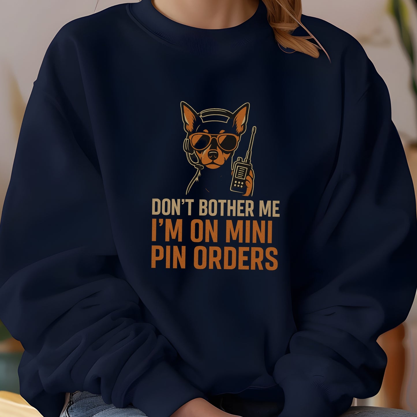 Navy unisex sweatshirt with a Miniature Pinscher in headset and sunglasses, text: "DON’T BOTHER ME I’M ON MINI PIN ORDERS"