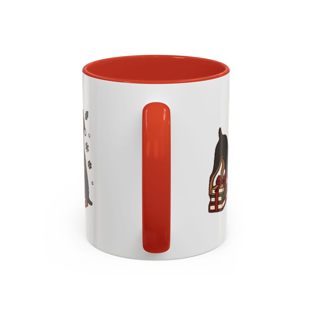 White ceramic mug with a red interior and red handle, back view with partial Mini Pinscher illustrations on either side of the handle.