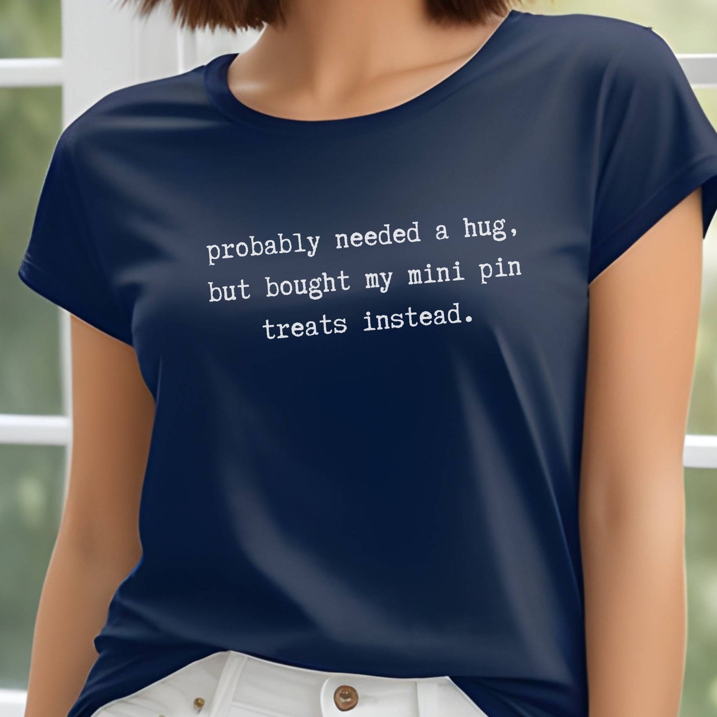 Navy unisex t-shirt with white text: "probably needed a hug, but bought my mini pin treats instead."