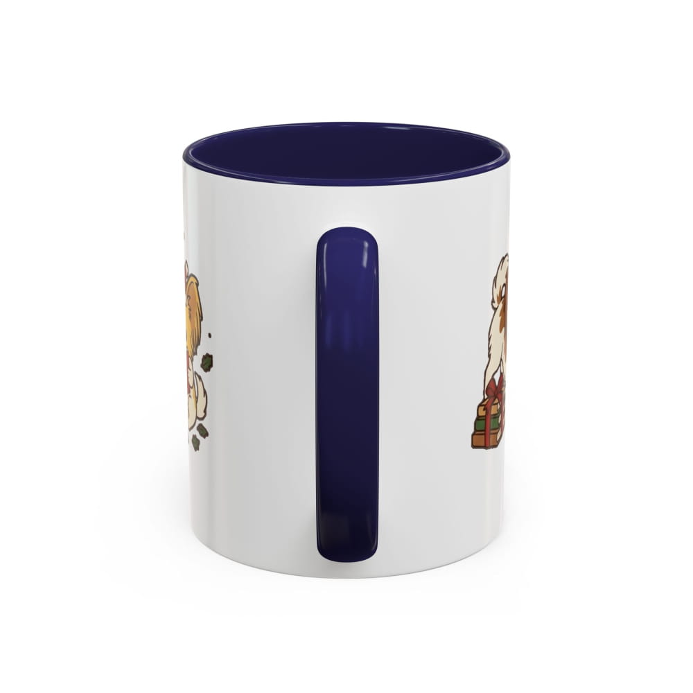 White ceramic mug with a navy interior and navy handle, back view with partial Papillon illustrations on either side of the handle.