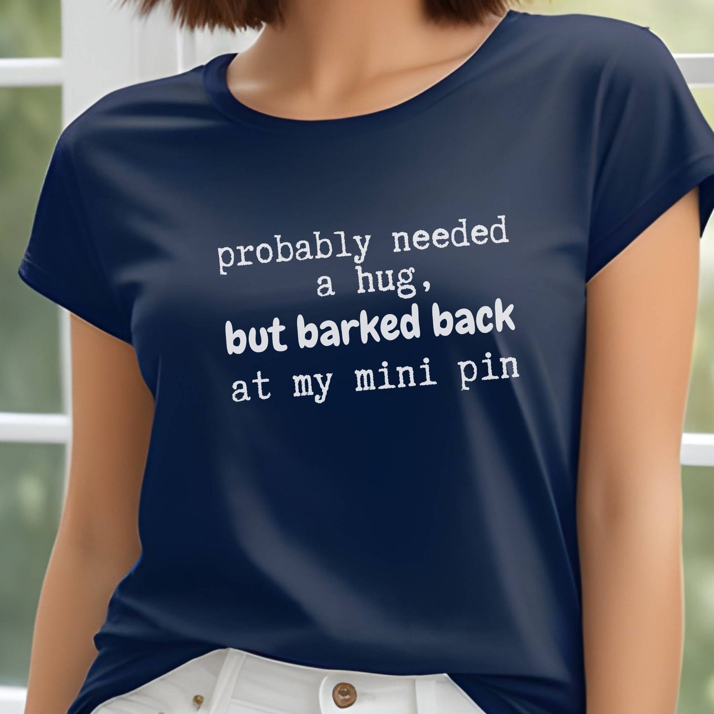 Navy unisex t-shirt with white text: "probably needed a hug, but barked back at my mini pin" centered on the chest