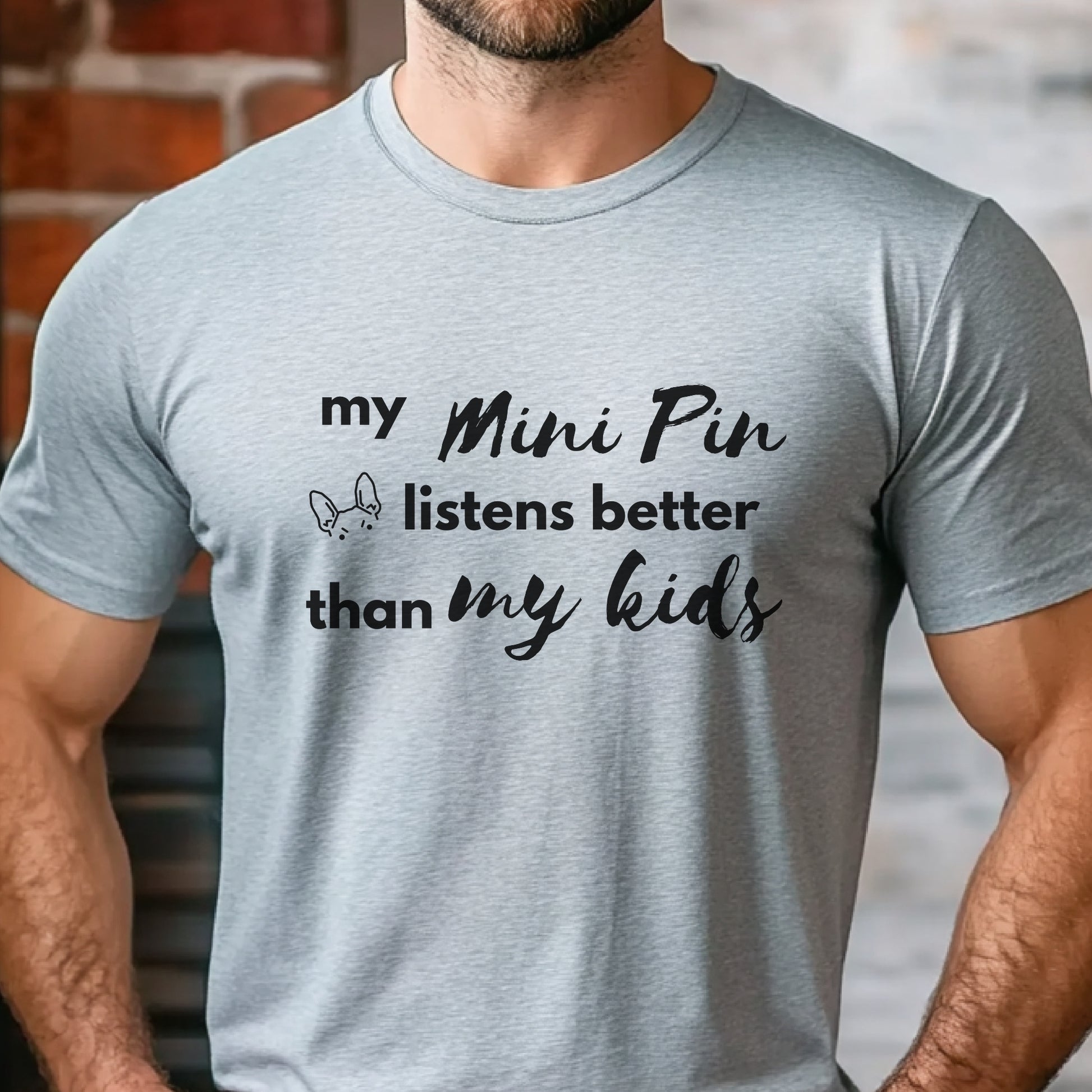 Grey unisex t-shirt with white text: "my Mini Pin listens better than my kids" and a small Miniature Pinscher face illustration