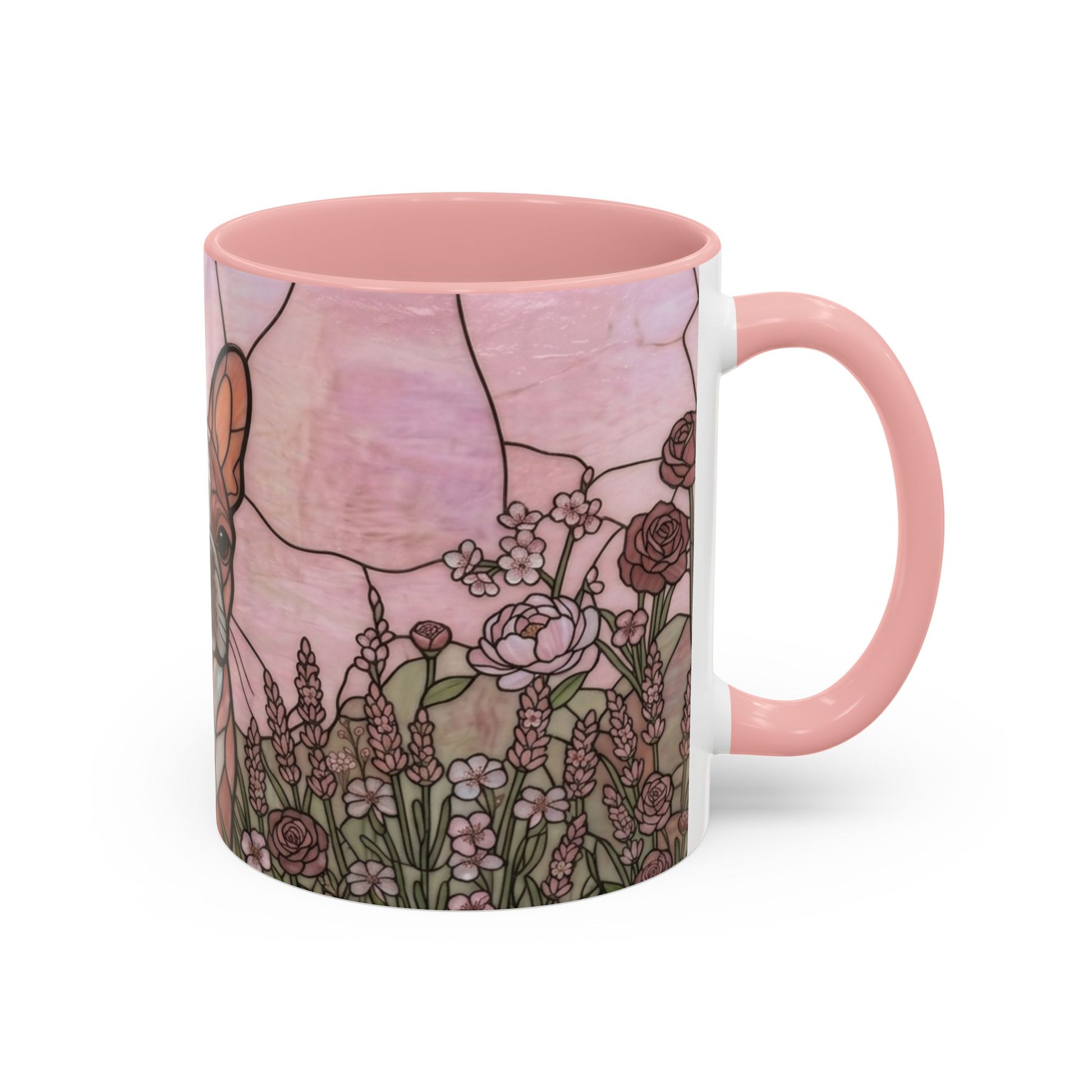 Mug with floral design and pink handle on a white background