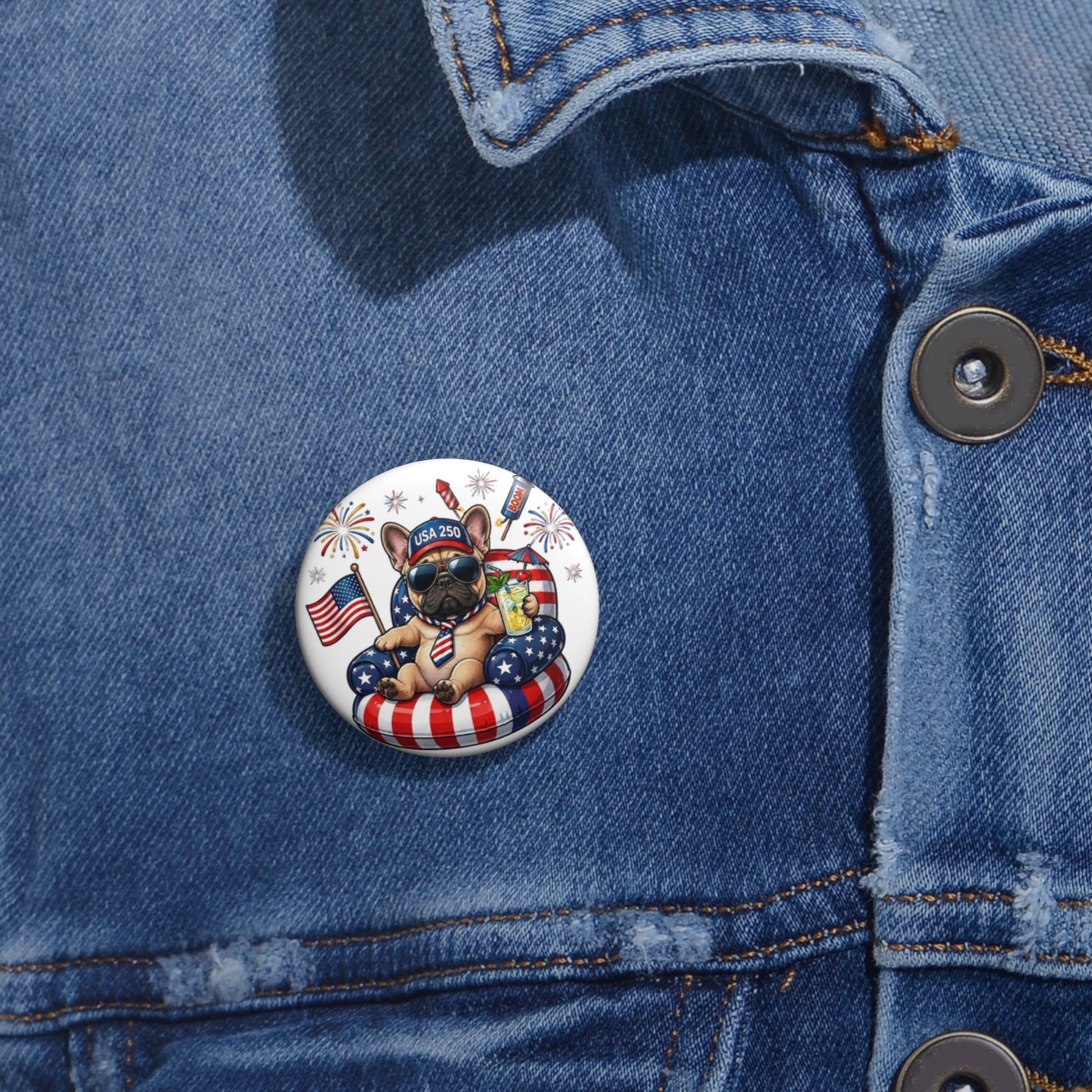 Button with a dog wearing an American flag outfit on a blue denim jacket.