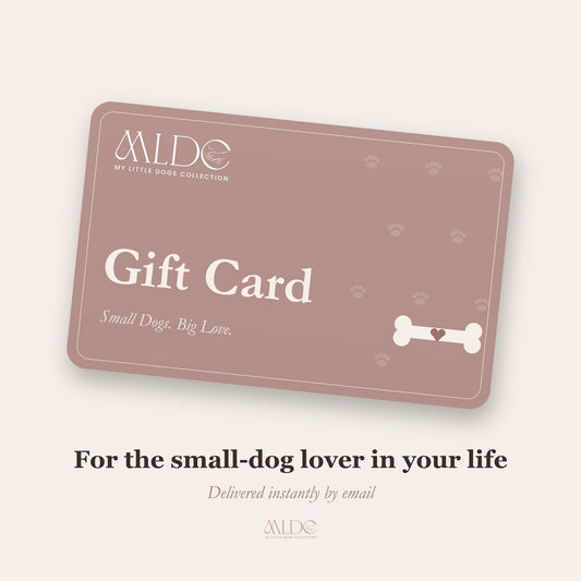 A rectangular gift card with rounded corners in a muted dusty rose color, featuring the text 'Gift Card', 'Small Dogs. Big Love.