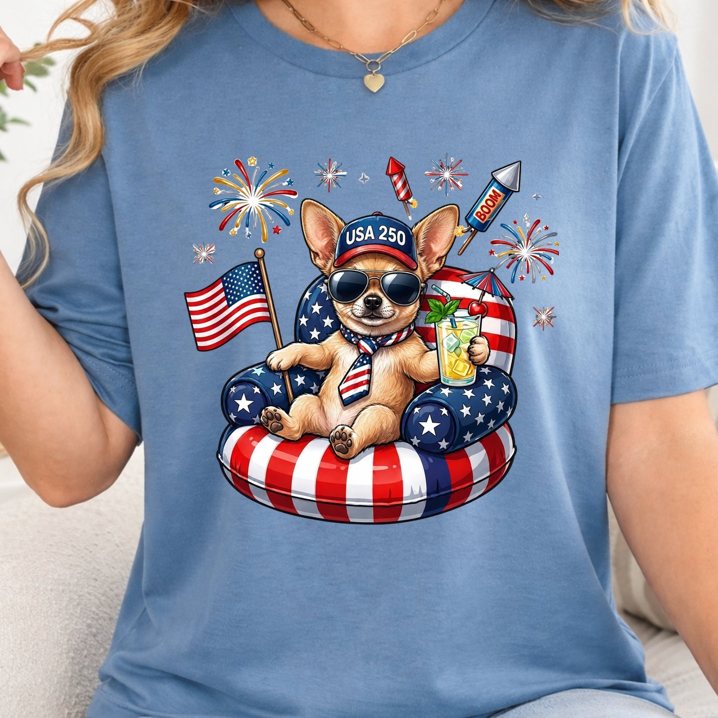 Person wearing a blue t-shirt with a dog graphic celebrating the 4th of July.