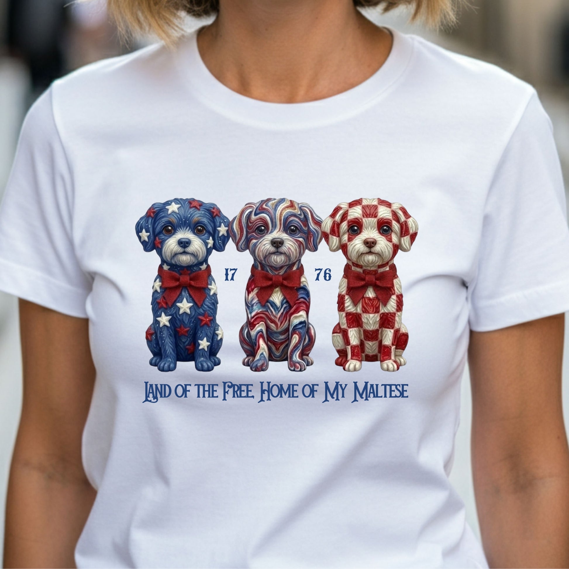 White t-shirt with three Maltese dogs design and text, worn by a person.