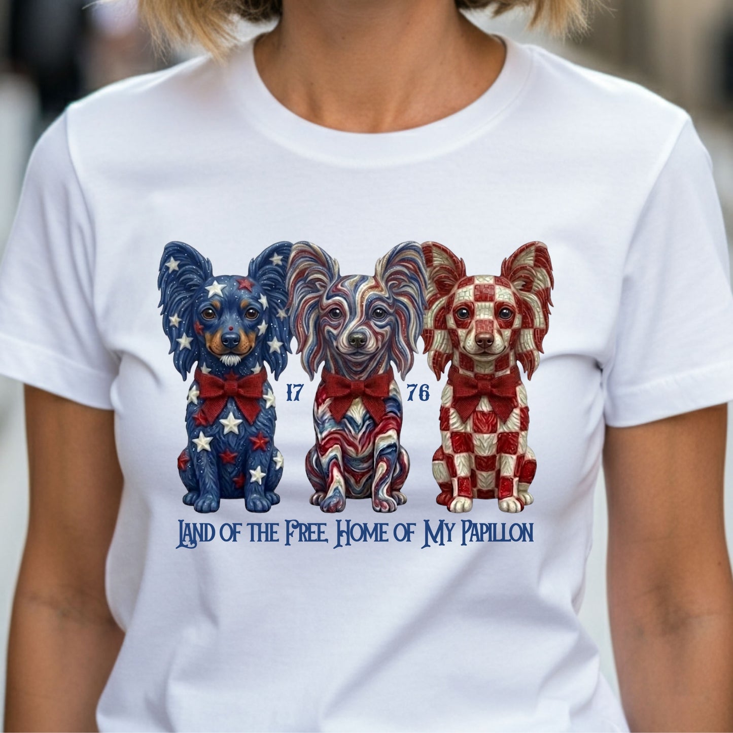 White t-shirt with colorful dog illustrations and text on a person wearing it.