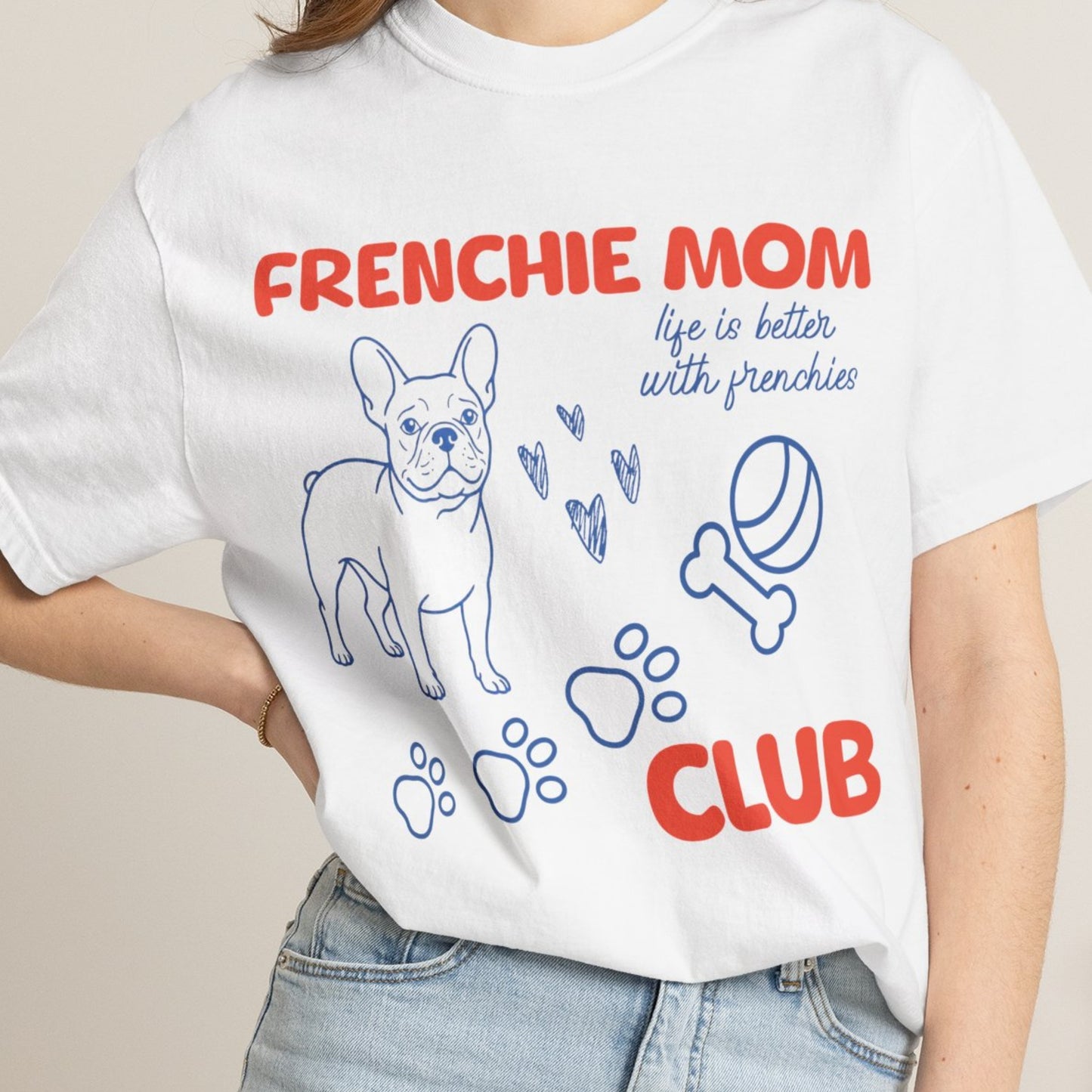 White t-shirt with 'FRENCHIE MOM CLUB' text and dog graphics worn by a person.