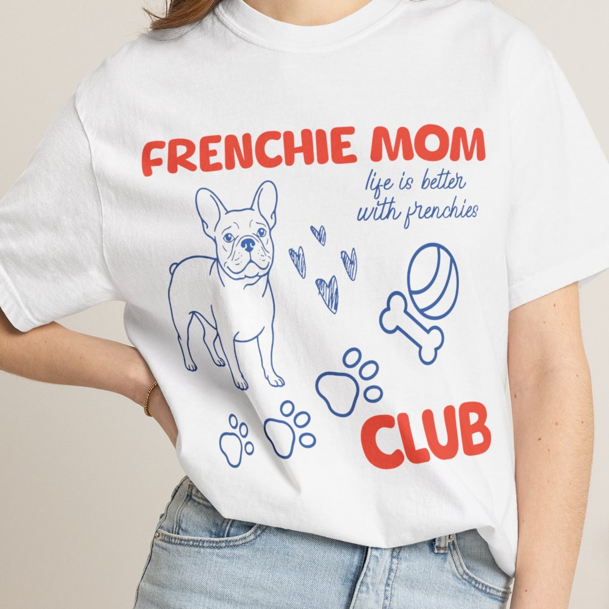 White t-shirt with 'FRENCHIE MOM CLUB' text and dog graphics worn by a person.