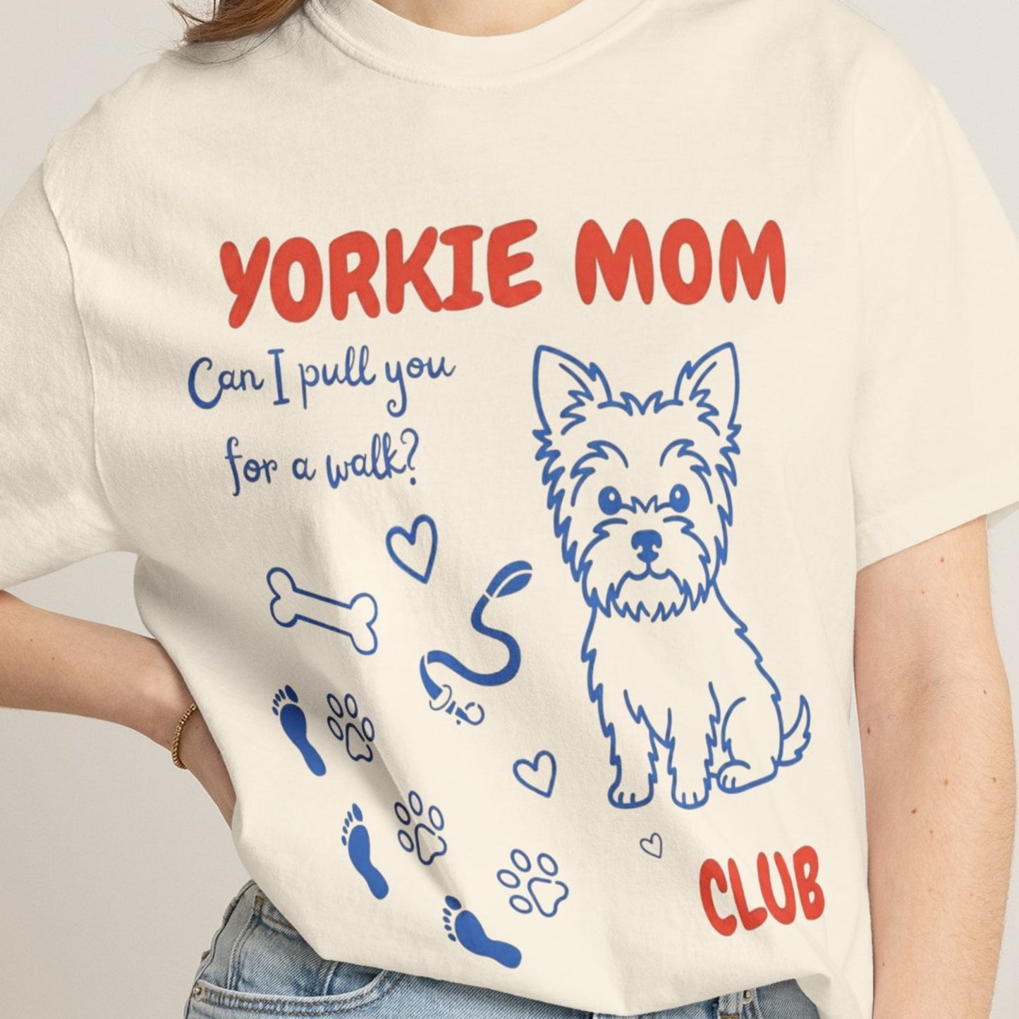 Person wearing a t-shirt with 'Yorkie Mom' design and text.