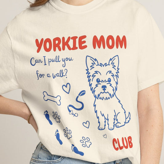 Person wearing a t-shirt with 'Yorkie Mom' design and text.