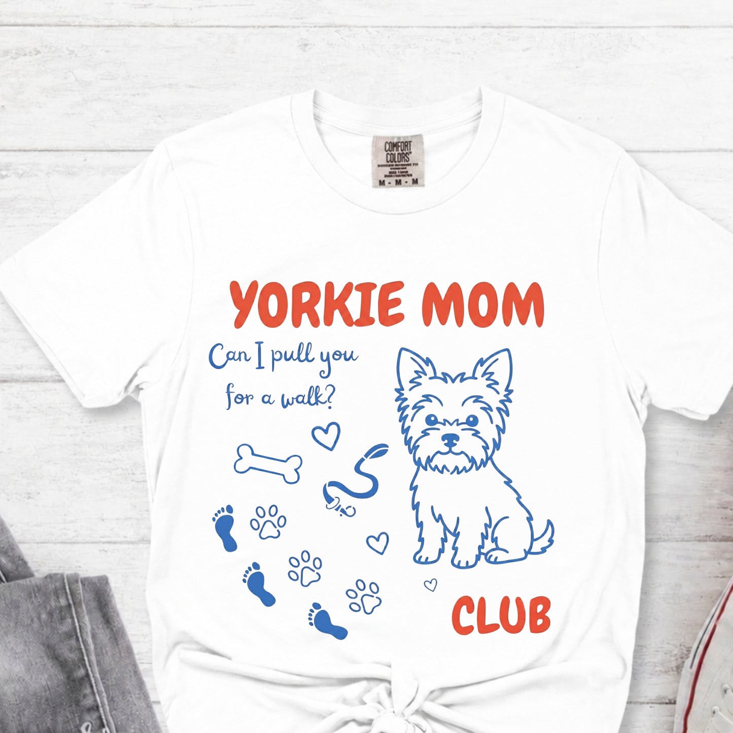 White t-shirt with 'Yorkie Mom Club' design featuring a dog illustration on a white background.