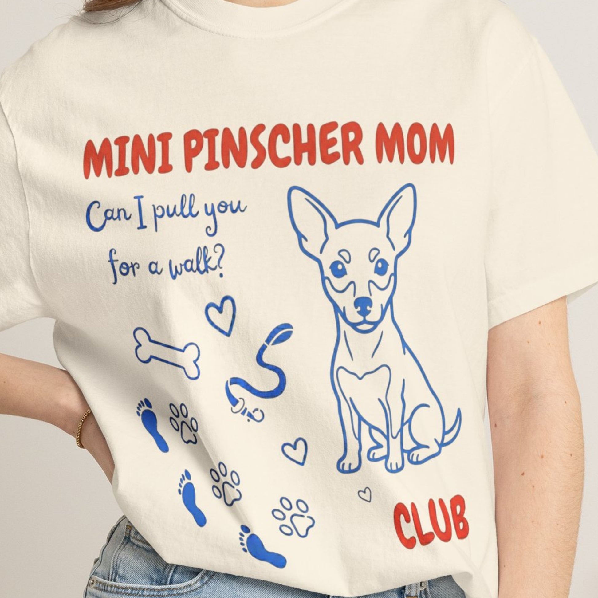 T-shirt with 'Mini Pinscher Mom' design and text on a plain background
