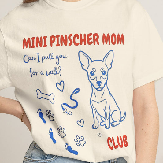 T-shirt with 'Mini Pinscher Mom' design and text on a plain background