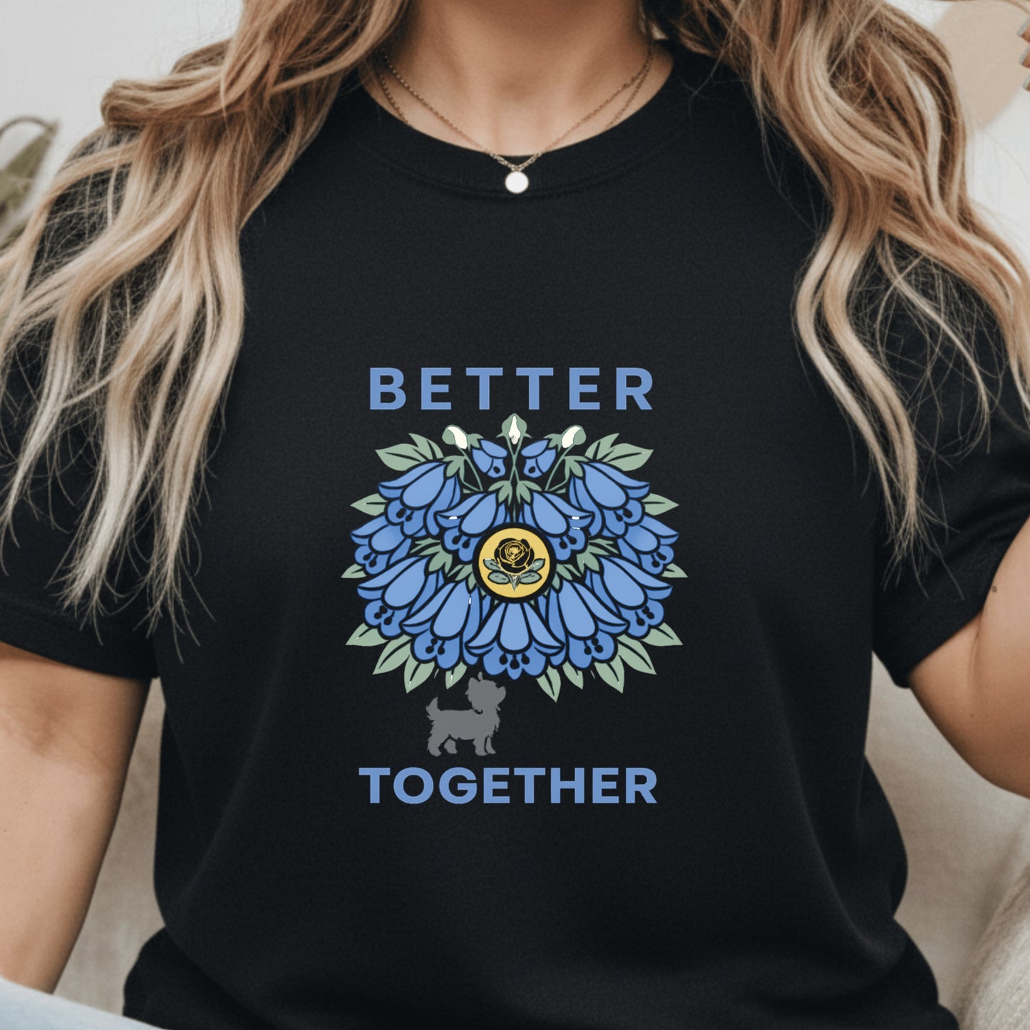 Person wearing a black t-shirt with a blue floral design and 'Better Together' text.
