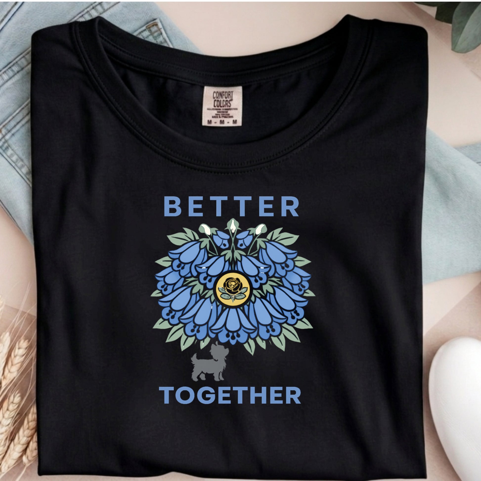 Black t-shirt with blue floral design and 'Better Together' text on a person wearing it.