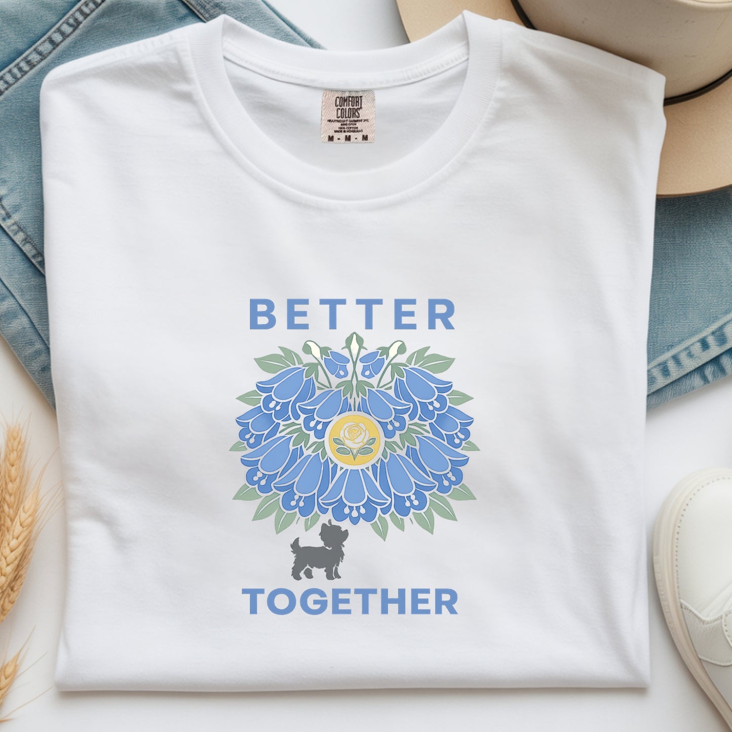 White t-shirt with blue floral design and 'Better Together' text on a light background