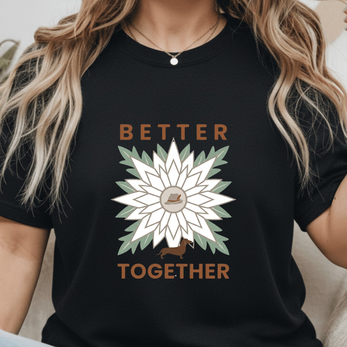 Black t-shirt with a sunflower design and 'Better Together' text worn by a person.