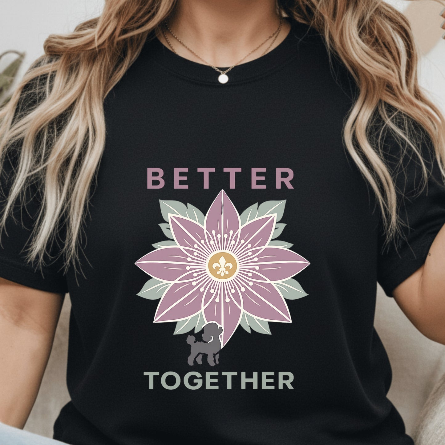 Black t-shirt with a pink flower design and 'Better Together' text worn by a person.