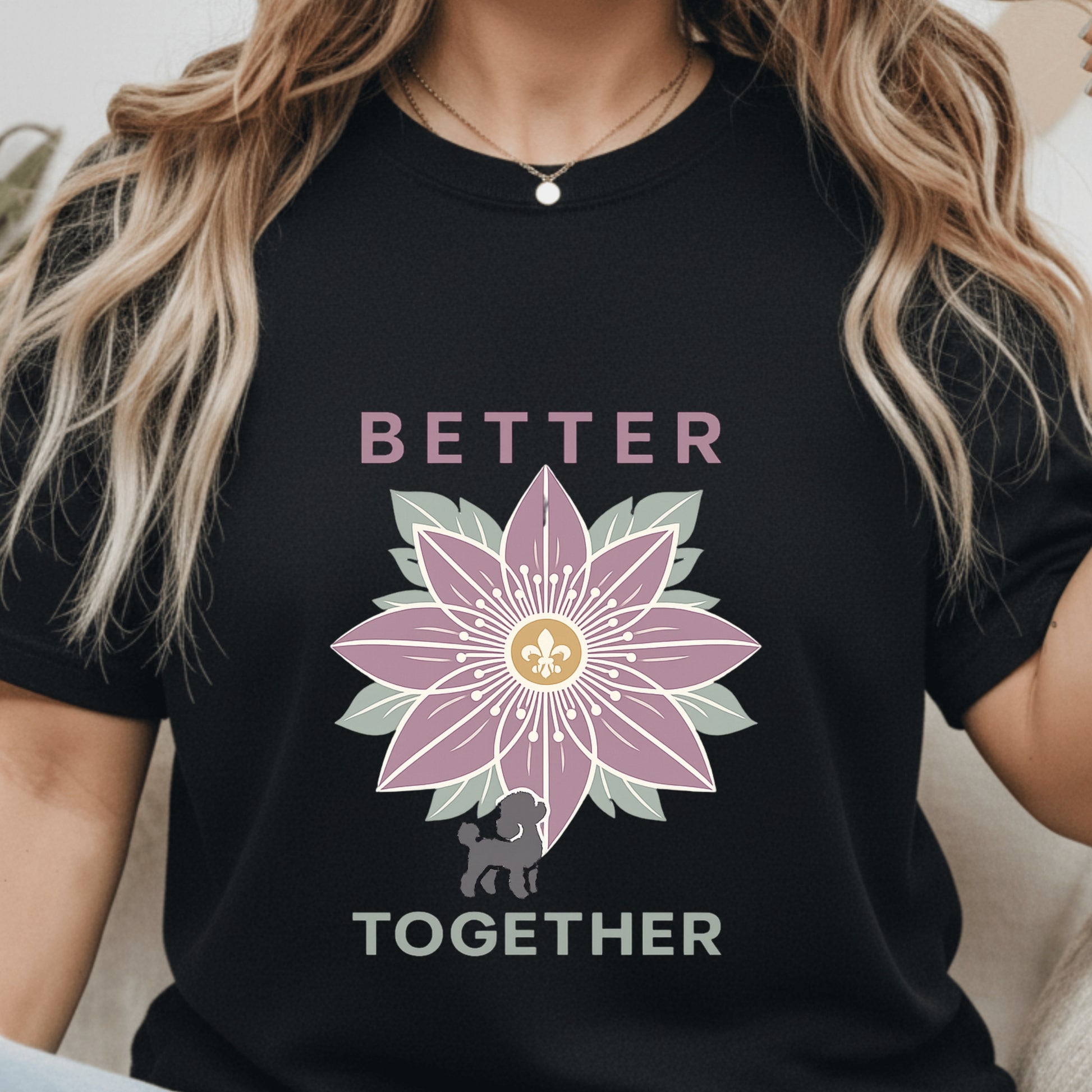 Black t-shirt with a pink flower design and 'Better Together' text worn by a person.