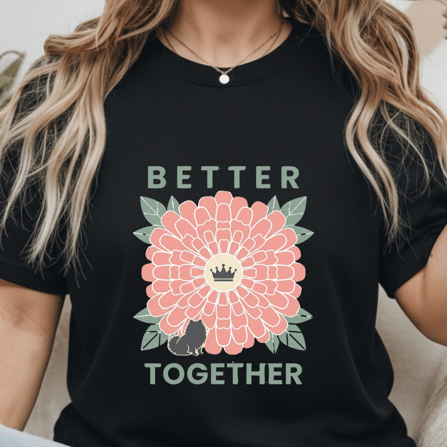 Person wearing a black t-shirt with a pink flower graphic and 'Better Together' text.