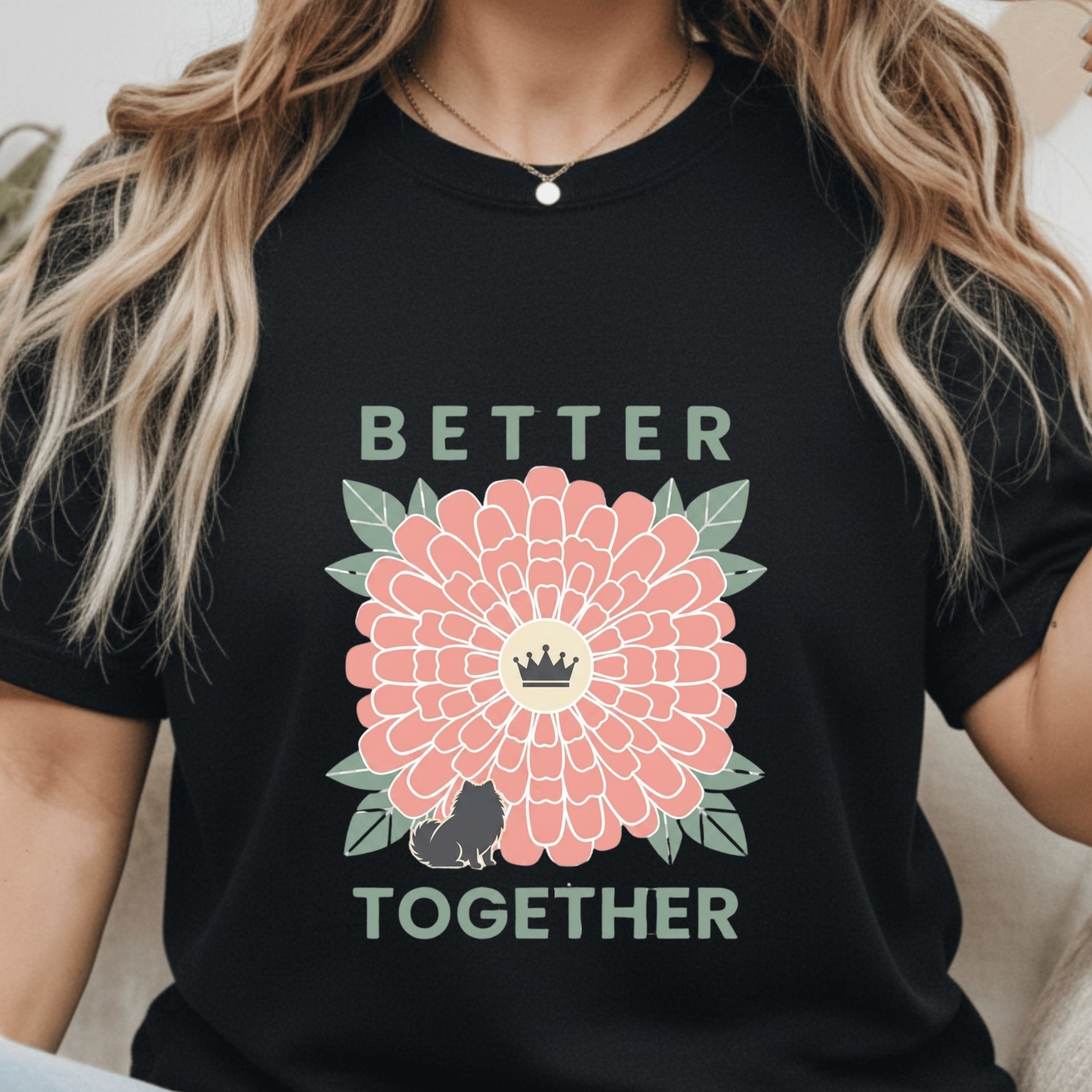 Person wearing a black t-shirt with a pink flower graphic and 'Better Together' text.