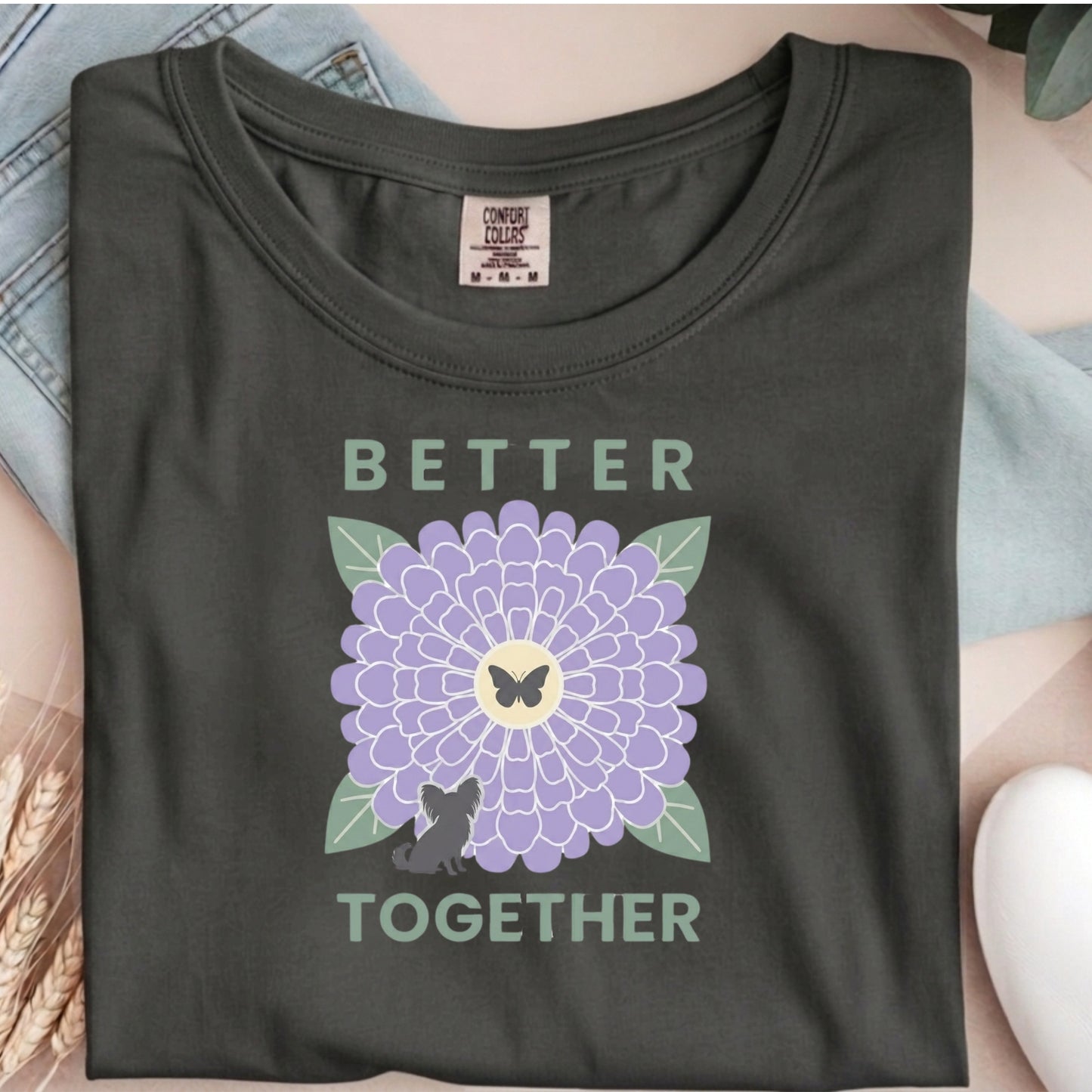 Dark gray t-shirt with a purple flower and butterfly graphic and 'Better Together' text.