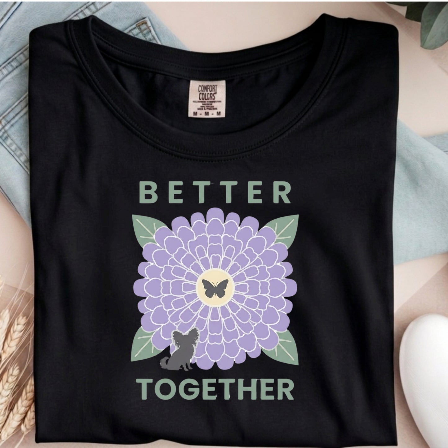 Black t-shirt with a purple flower and butterfly graphic and 'Better Together' text.