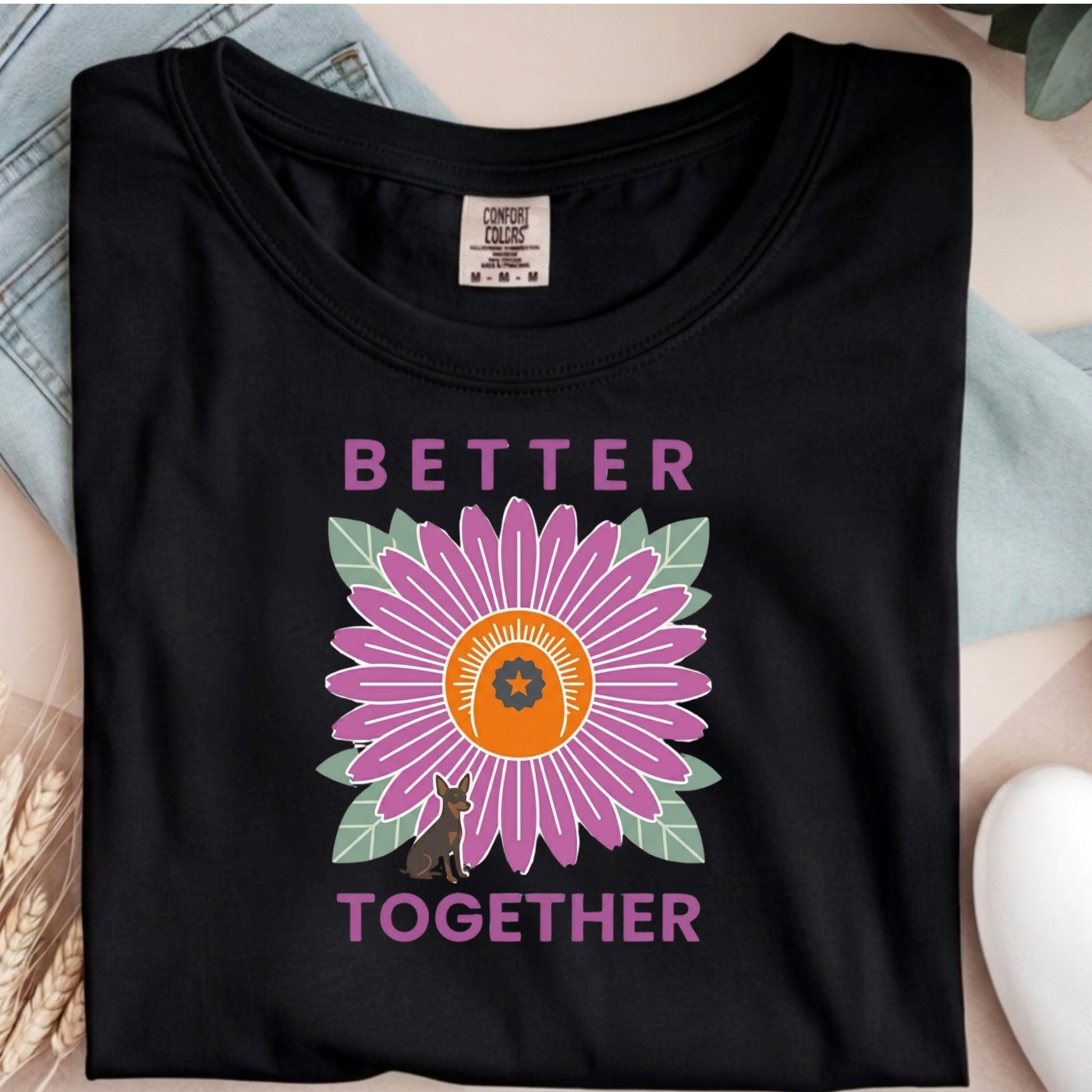 Black t-shirt with a purple flower graphic and 'Better Together' text on a neutral background