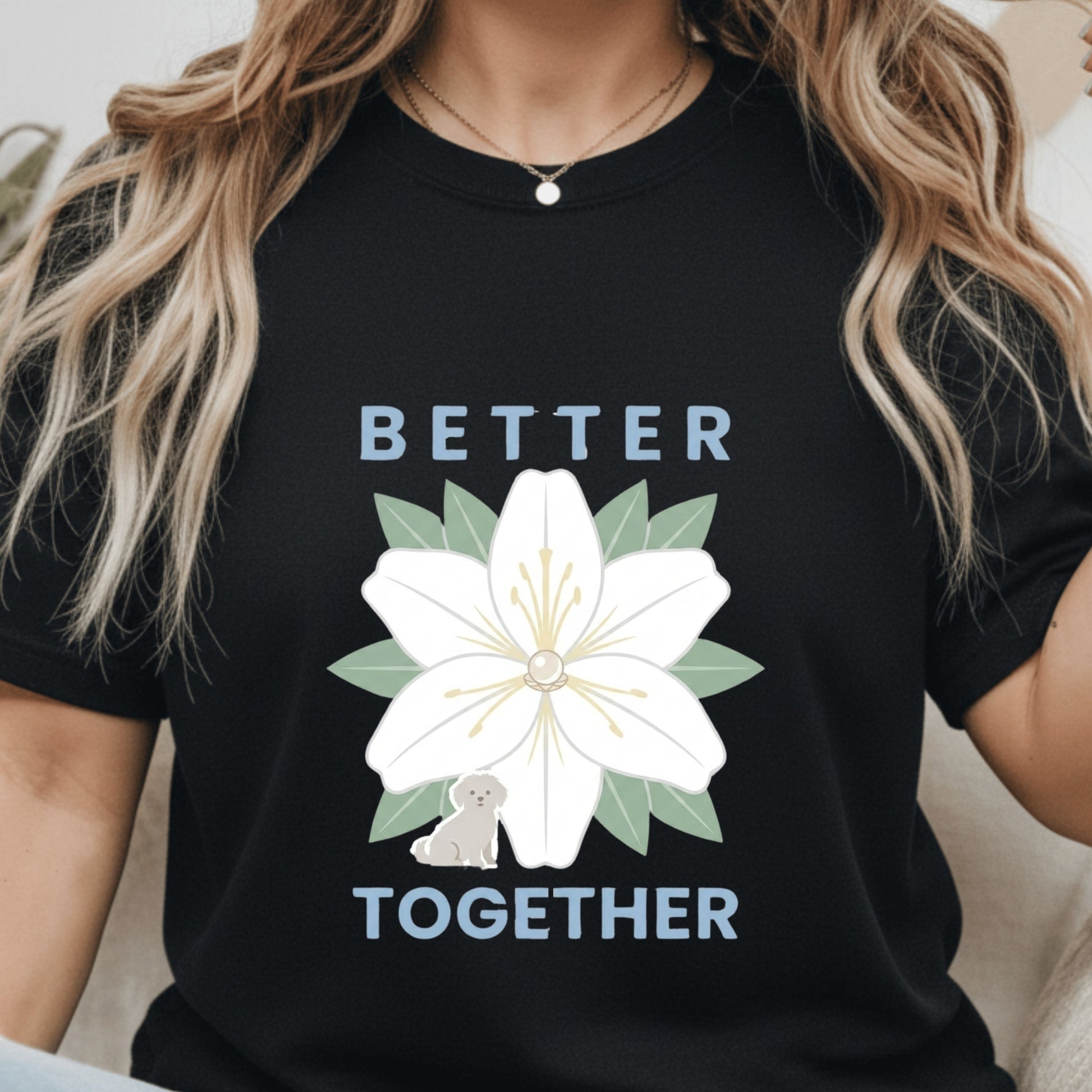 Black t-shirt with a white flower graphic and 'Better Together' text worn by a person.