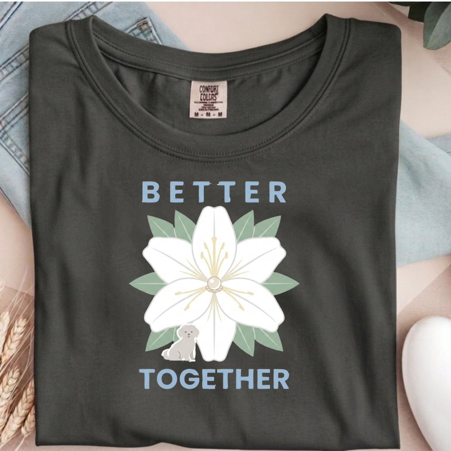 Dark gray t-shirt with a white flower graphic and 'Better Together' text on a person wearing it.