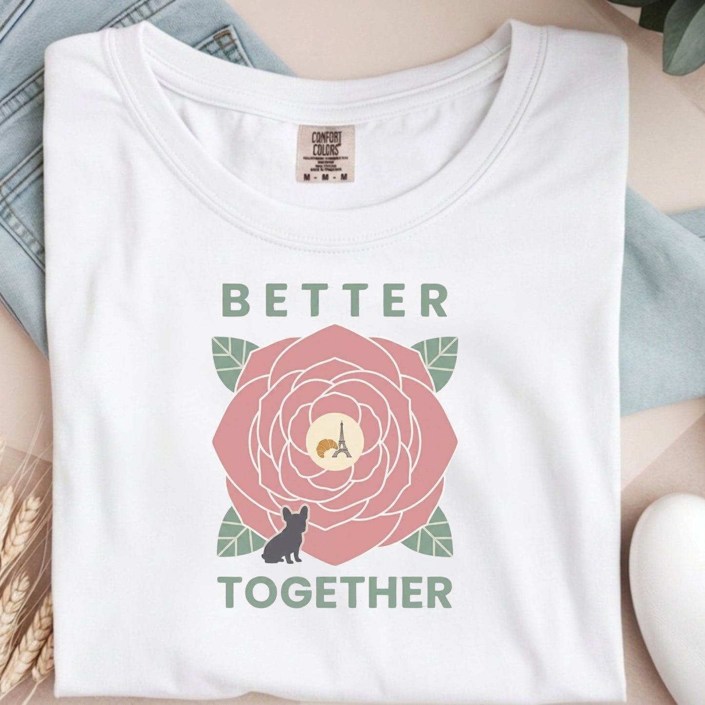 White t-shirt with a floral design and 'Better Together' text on a light background