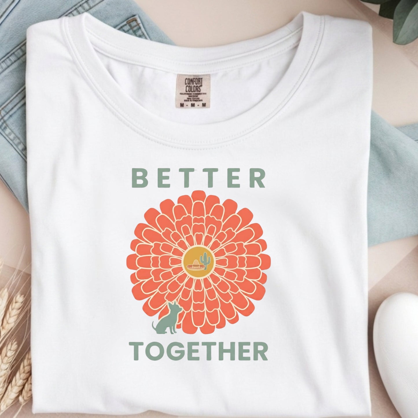 White t-shirt with a sunflower design and 'Better Together' text on a light background