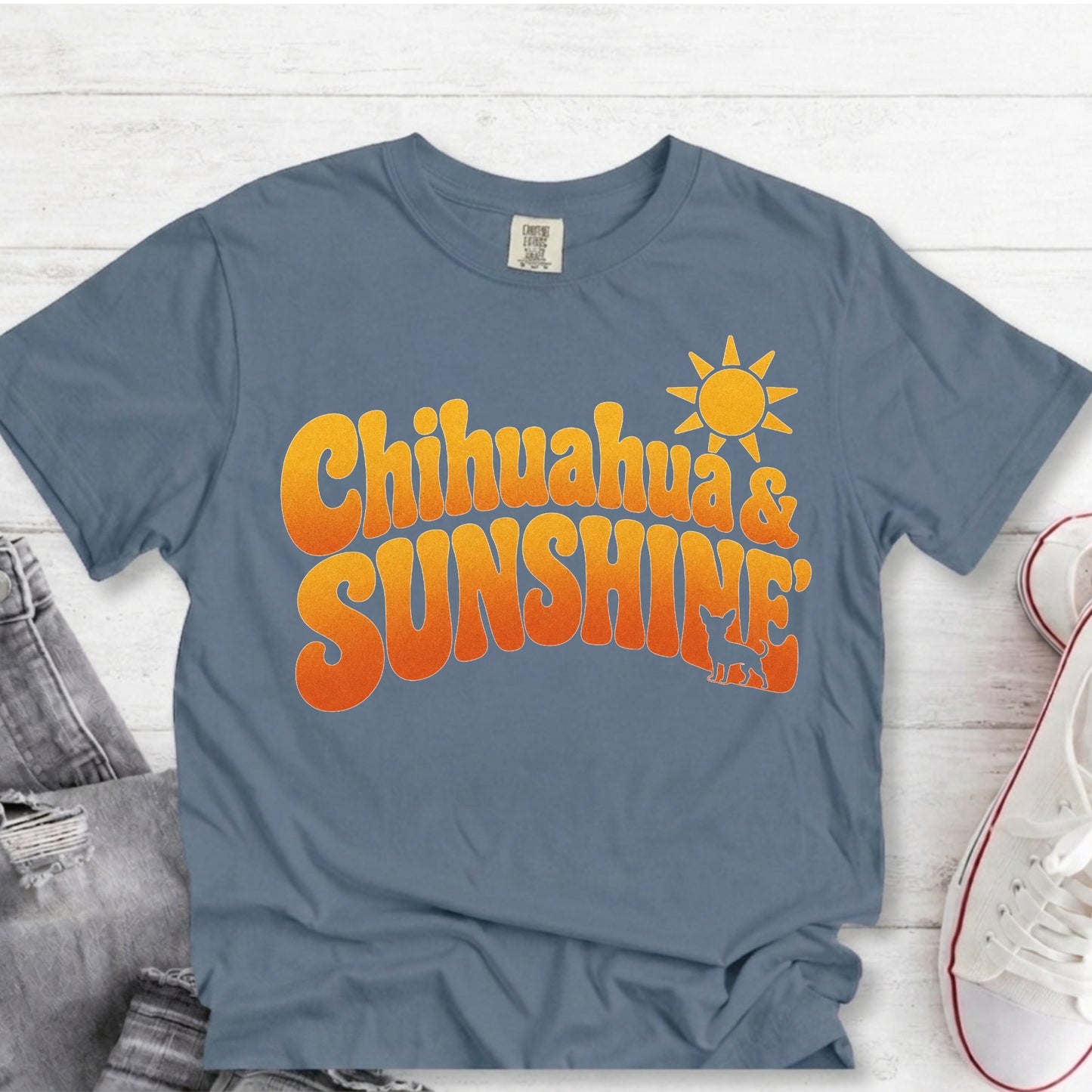 Chihuahua Sunshine retro blue t-shirt flat lay mockup for dog moms with yellow colored text "Chihuahuas & Sunshine".