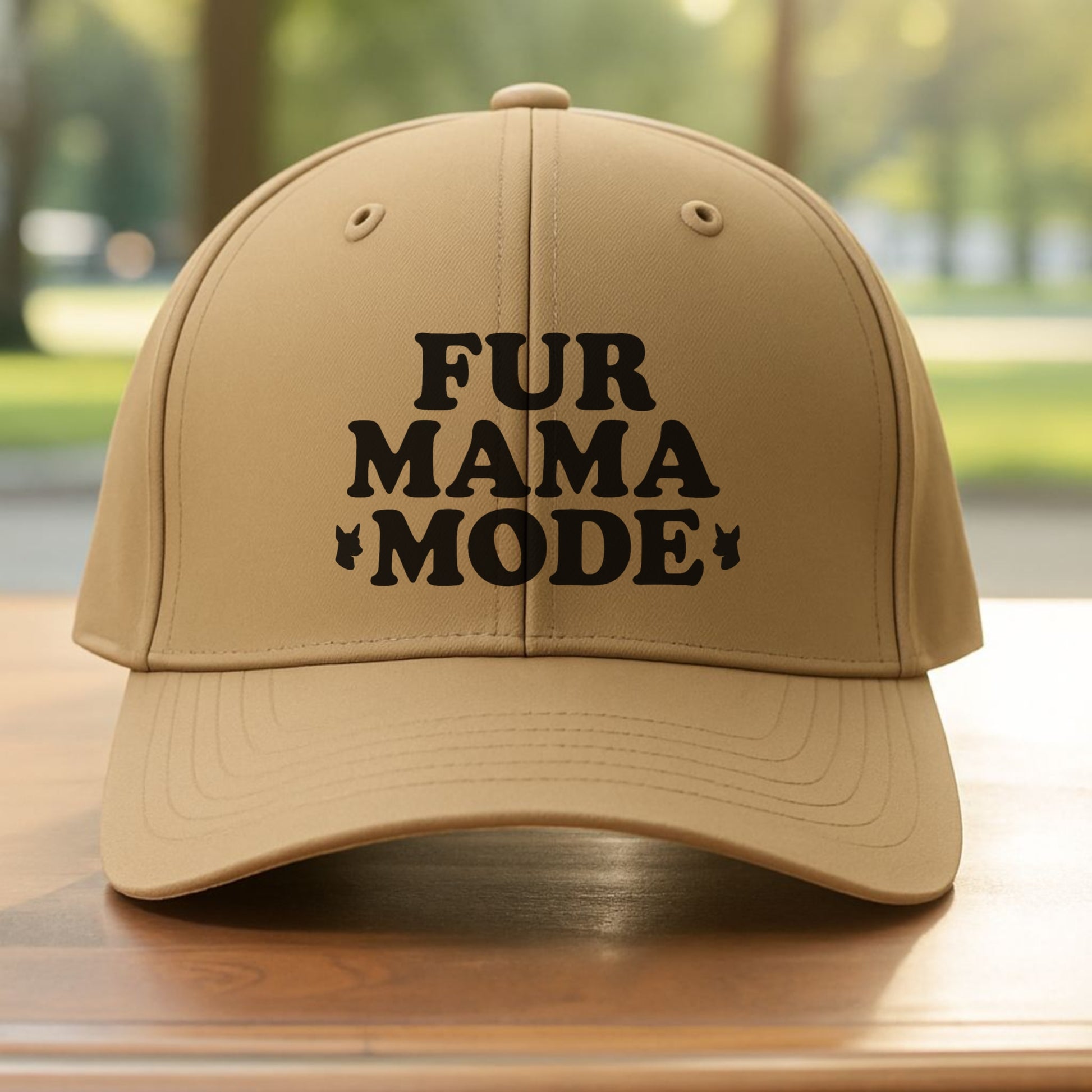 Khaki "Fur Mama Mode" Miniature Pinscher cap on a wooden table at the beach, perfect for dog moms and Min Pin lovers