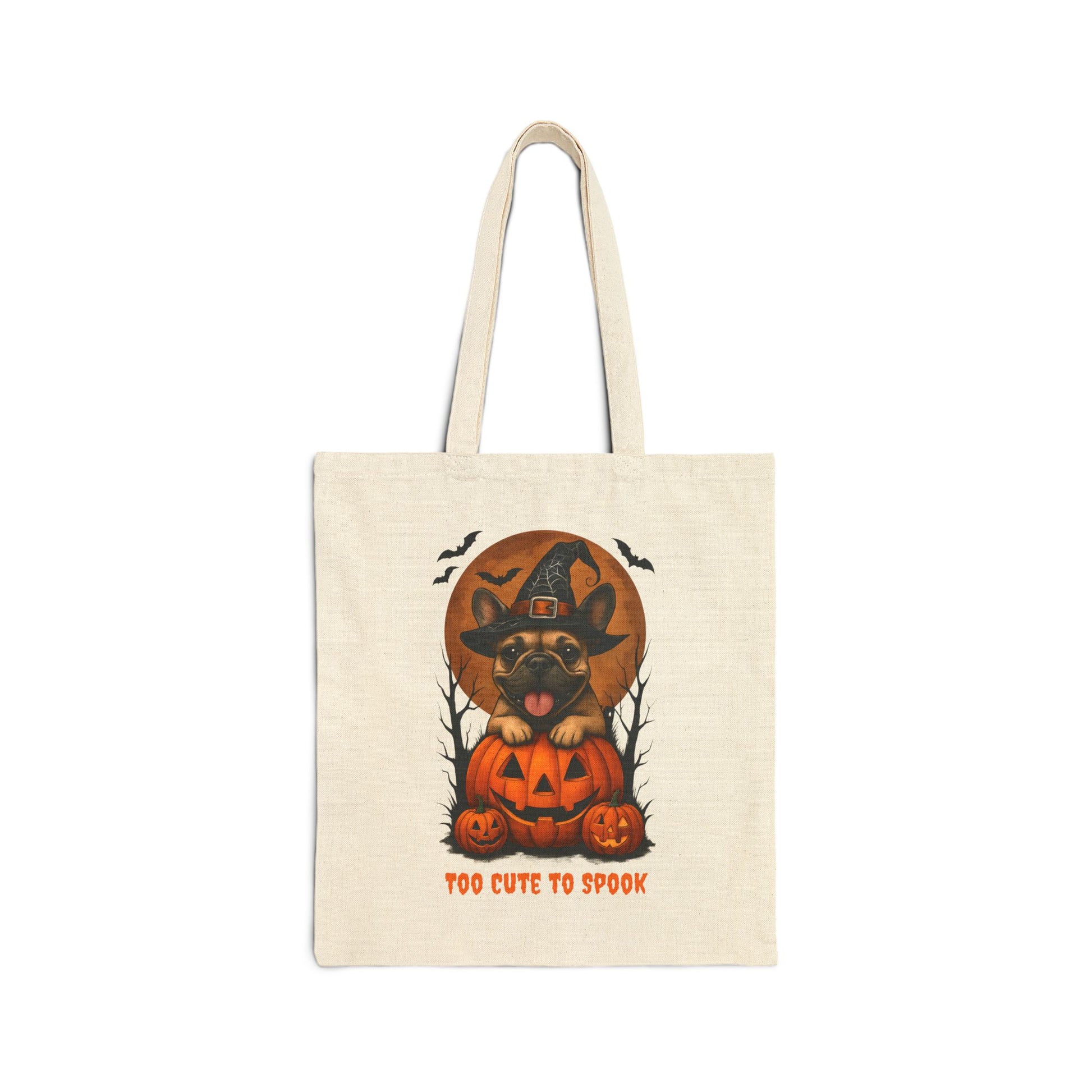 Tote bag with Halloween design of a dog in a pumpkin and witch hat, text 'Too Cute to Spook', on a white background.