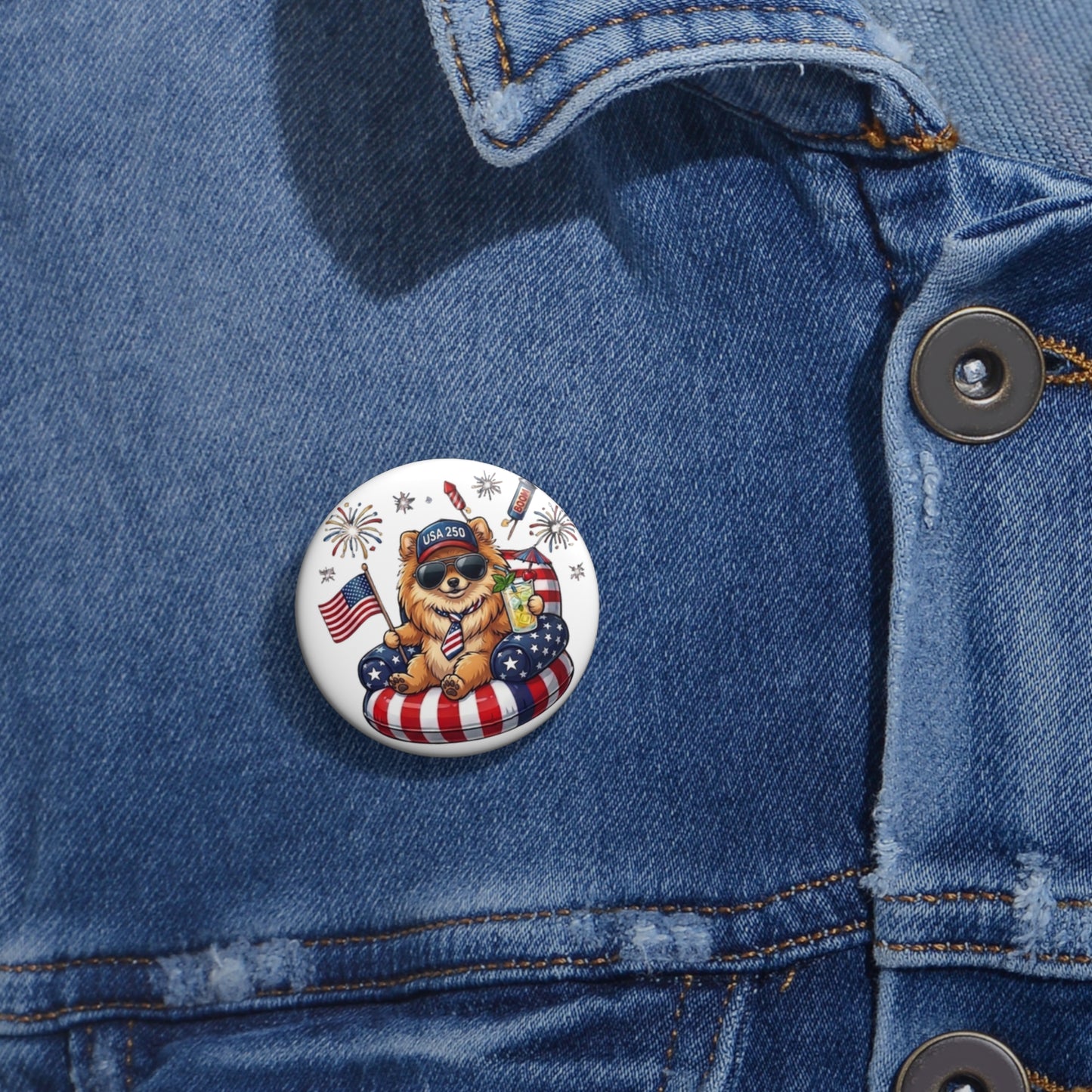 Button with a bear design featuring an American flag on a denim jacket.