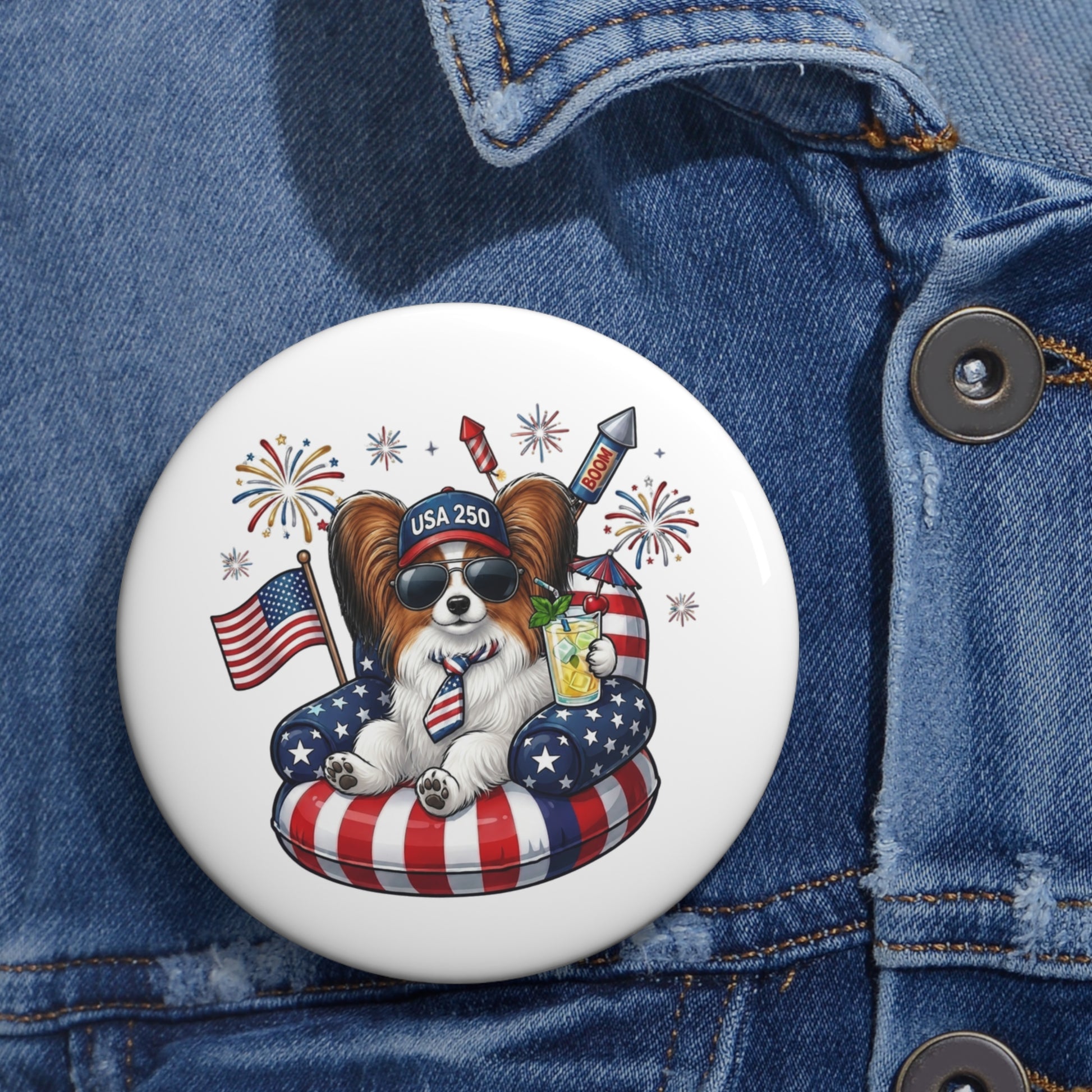 Button with a dog design featuring American flags and fireworks on a denim jacket.