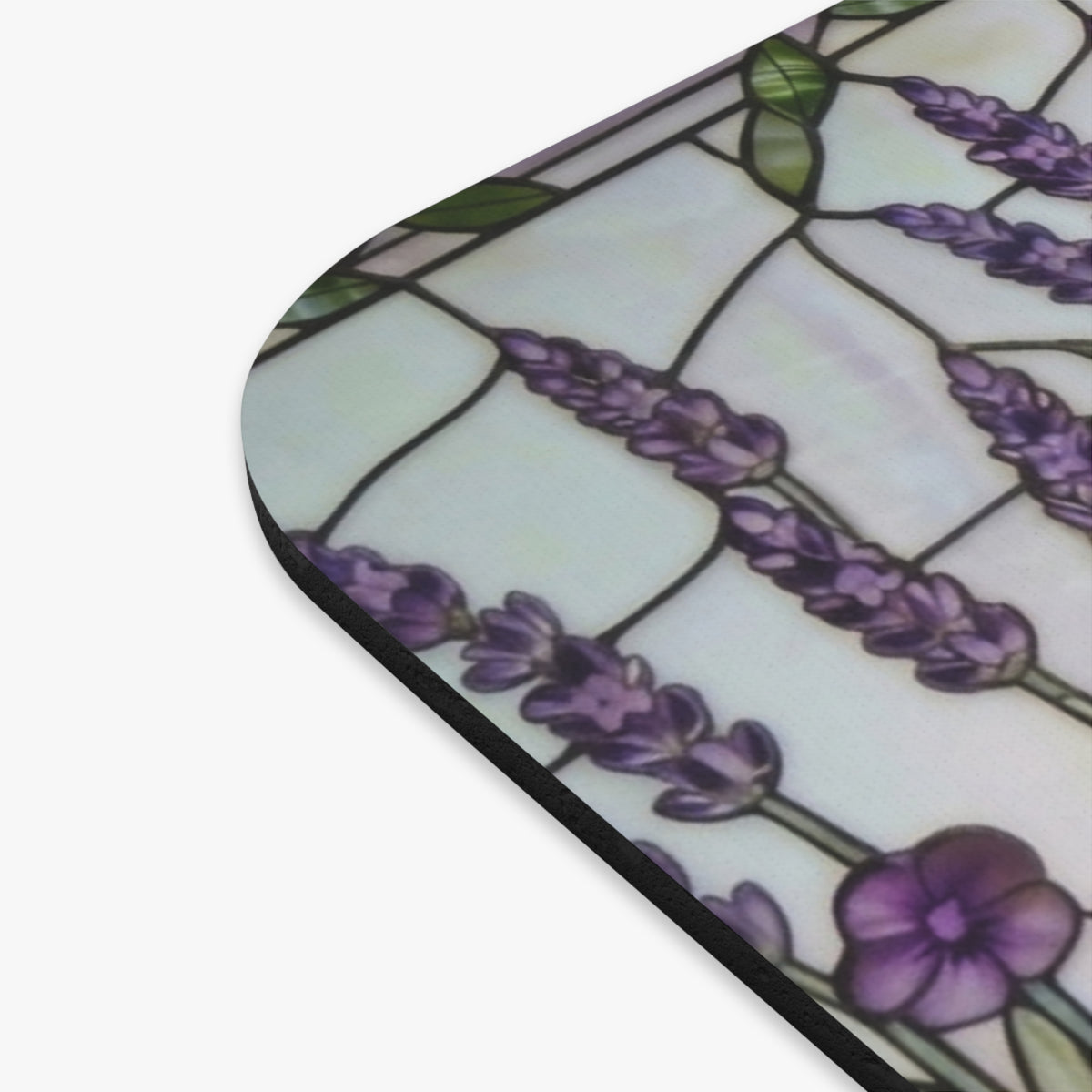 A close-up of a rounded-corner product, likely a mat or pad, featuring a stained-glass style design with purple lavender flowers, green leaves, and a white background with black outlines.