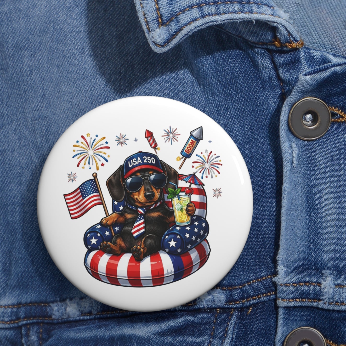 Button with a dachshund design featuring American flags and fireworks on a denim jacket.