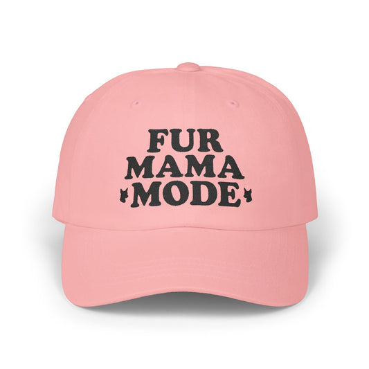 Pink "Fur Mama Mode" Miniature Pinscher cap on a wooden table at the beach, perfect for dog moms and Min Pin lovers
