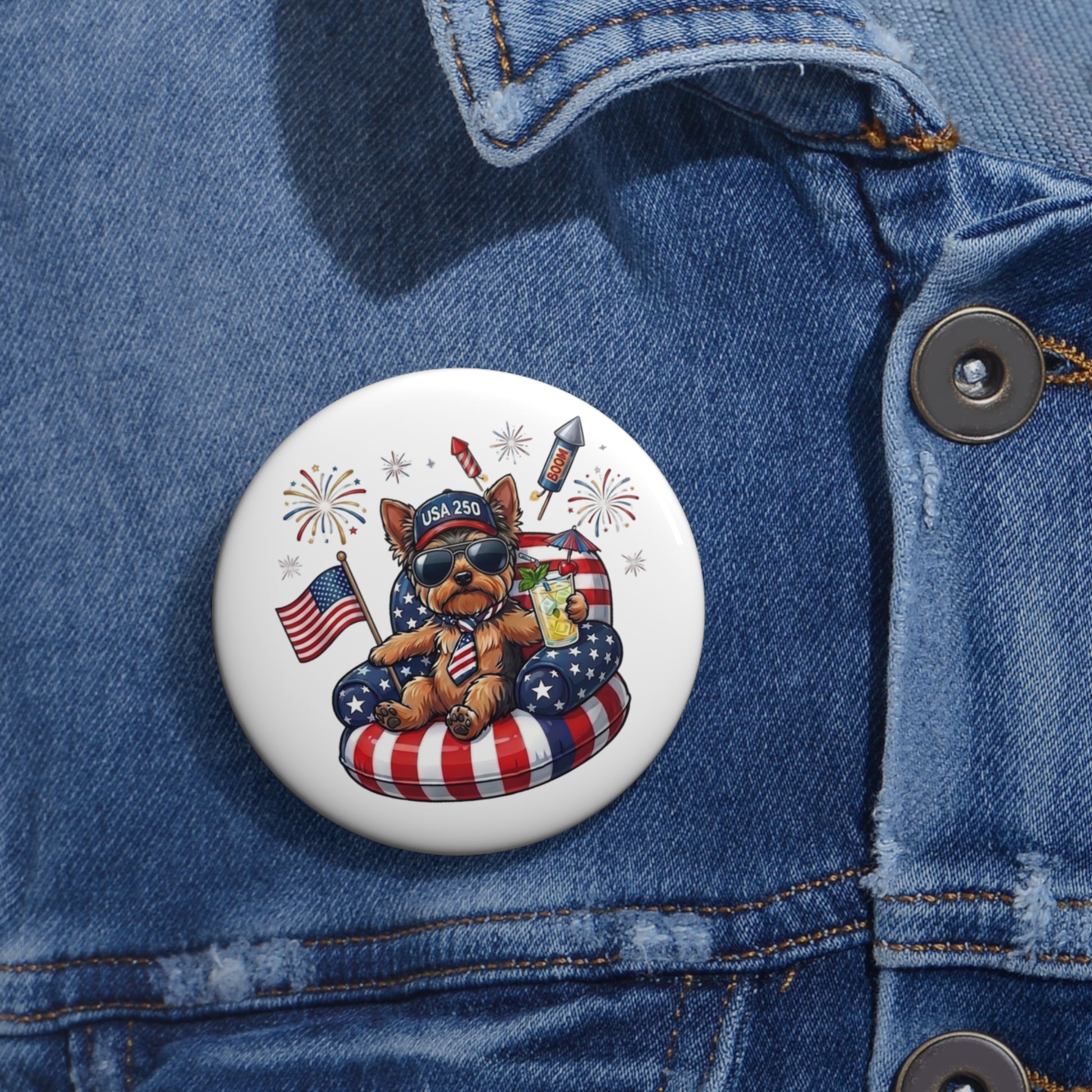 Button with a bear design featuring American flags and fireworks on a denim jacket.