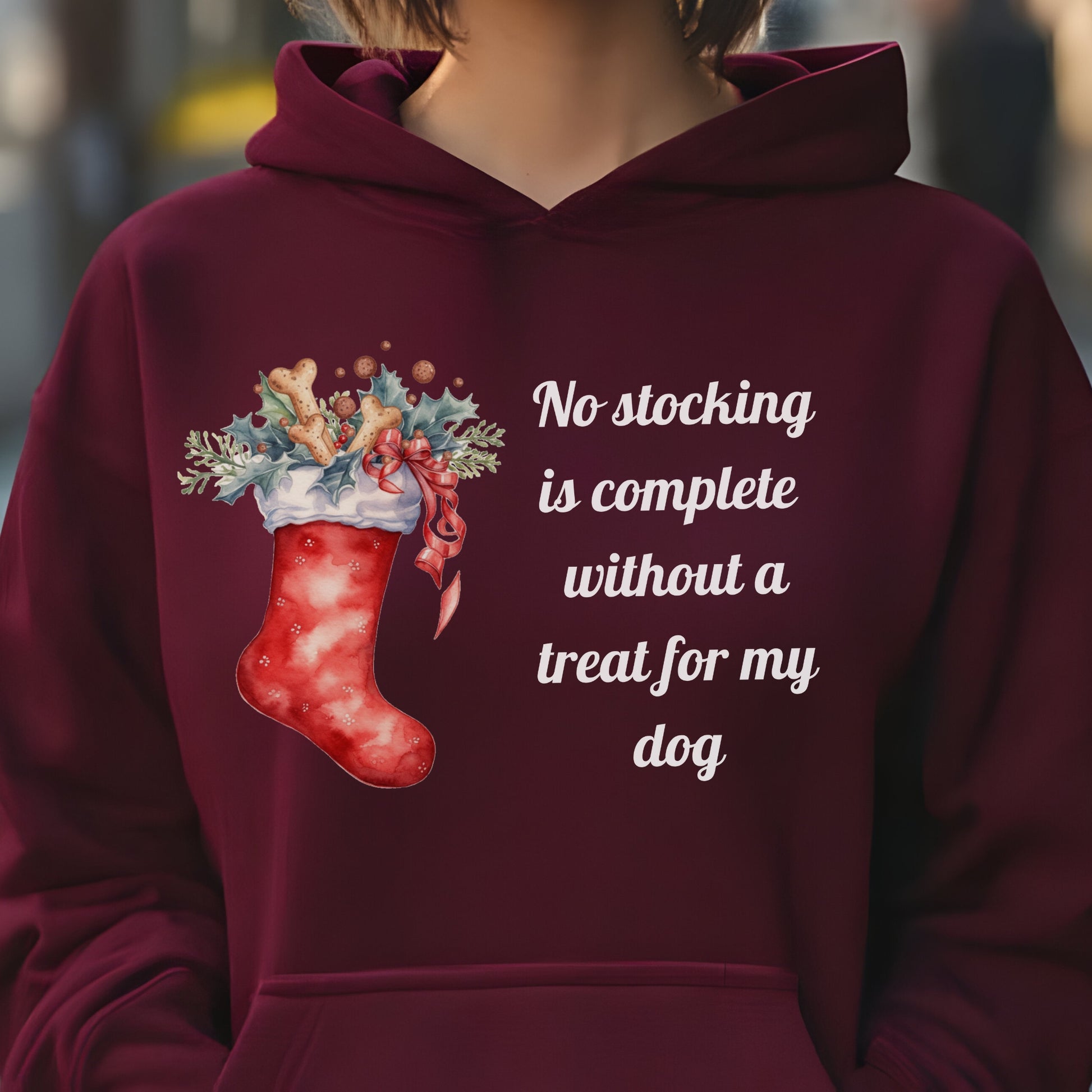 Maroon Christmas dog lover hoodie with a festive stocking filled with treats and a holiday quote reading “No stocking is complete without a treat for my dog.