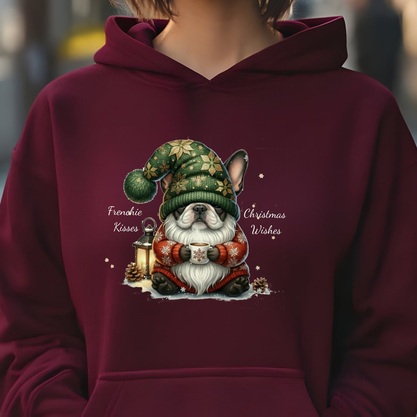 Maroon hoodie with adorable French Bulldog dressed as a Christmas gnome, holding a lantern in festive holiday attire